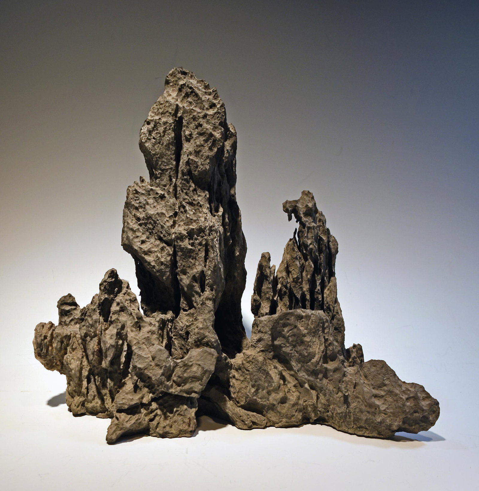 Chinese Scholar's Stone: A limestone scholar's stone from the Lingbi, Anhui province in China. Dimensions: 11 3/8 inches tall X 13 inches wide; 28.9 cm tall X 33 cm wide. All measurements are approximate. Condition: Natural s