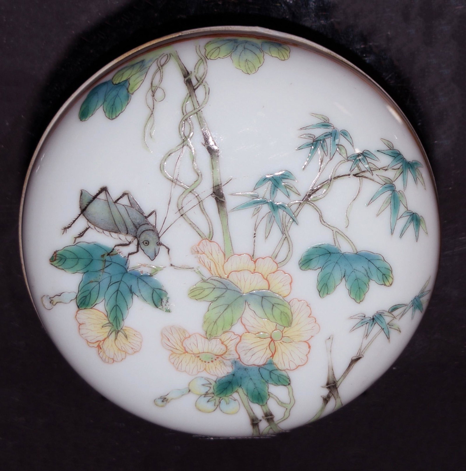 Famille Rose Seal Box, Republic Period: A famille rose seal box dating to the Republic period. The lid features a cricket and a flowering branch, the base features orange and gold-toned decoration and a 6-character mark. Dimensions: 1 1/2 i