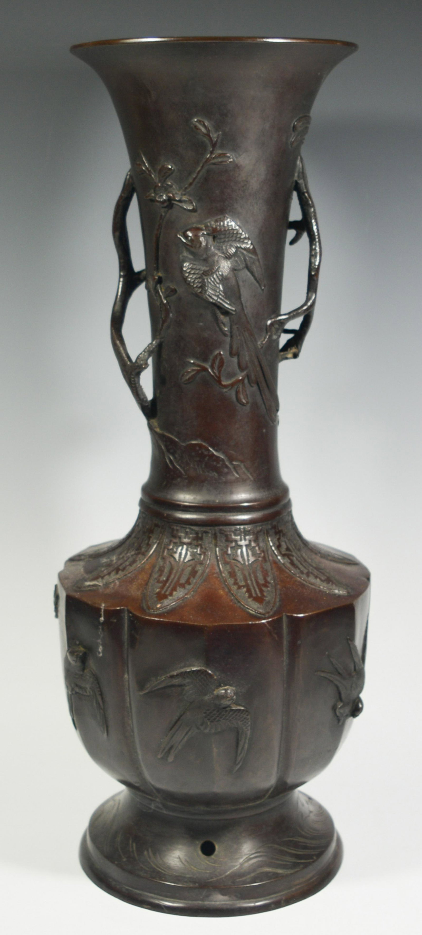 Japanese Bronze Vase with Birds, Meiji: A Japanese bronze vase with birds dating to the Meiji Era. The body is lobed with a tall neck, decorated with applied, cast and incised birds among branches and foliage. Drilled lamp. Dimensions: 22 i