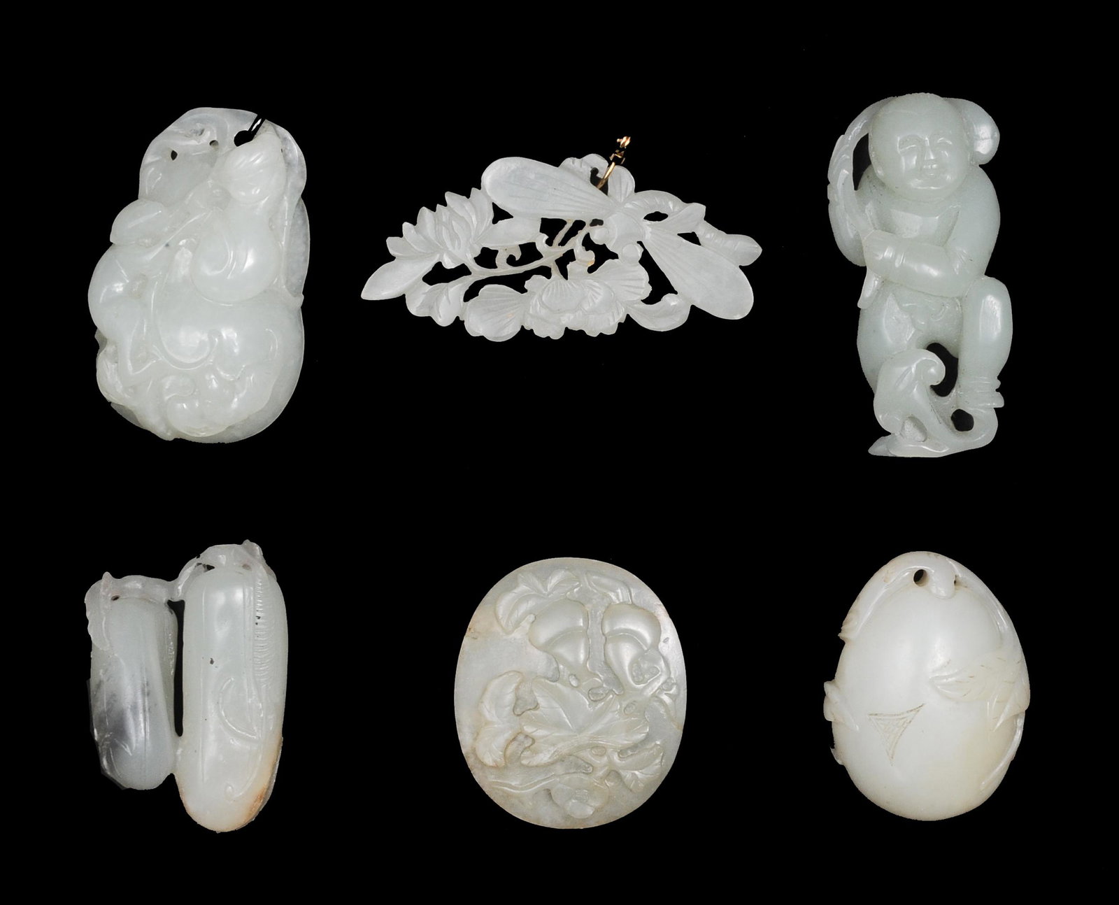 Group of 6 Chinese Jades, 18-19th Century: A group of 6 Chinese white jade carvings dating from the 18th to the 19th century. Carvings include: a toggle featuring a monkey, squirrel, and a fruit tree; a plaque featuring flowers, leaves and 2 h