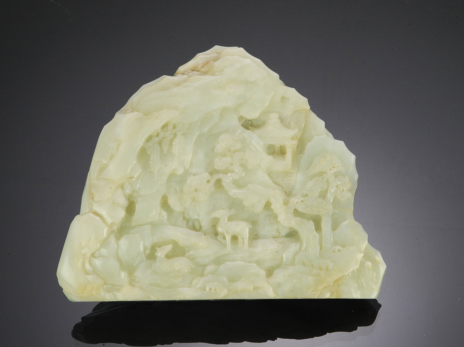 Chinese Jade Carving of Autumn Mountain, 18th Century: A Chinese carved jade boulder dating from the 18th century. The boulder features trees on the front and a pair of deer, pine trees, and a pagoda on the back. Dimensions are: 5 1/2 inches tall X 7 inch