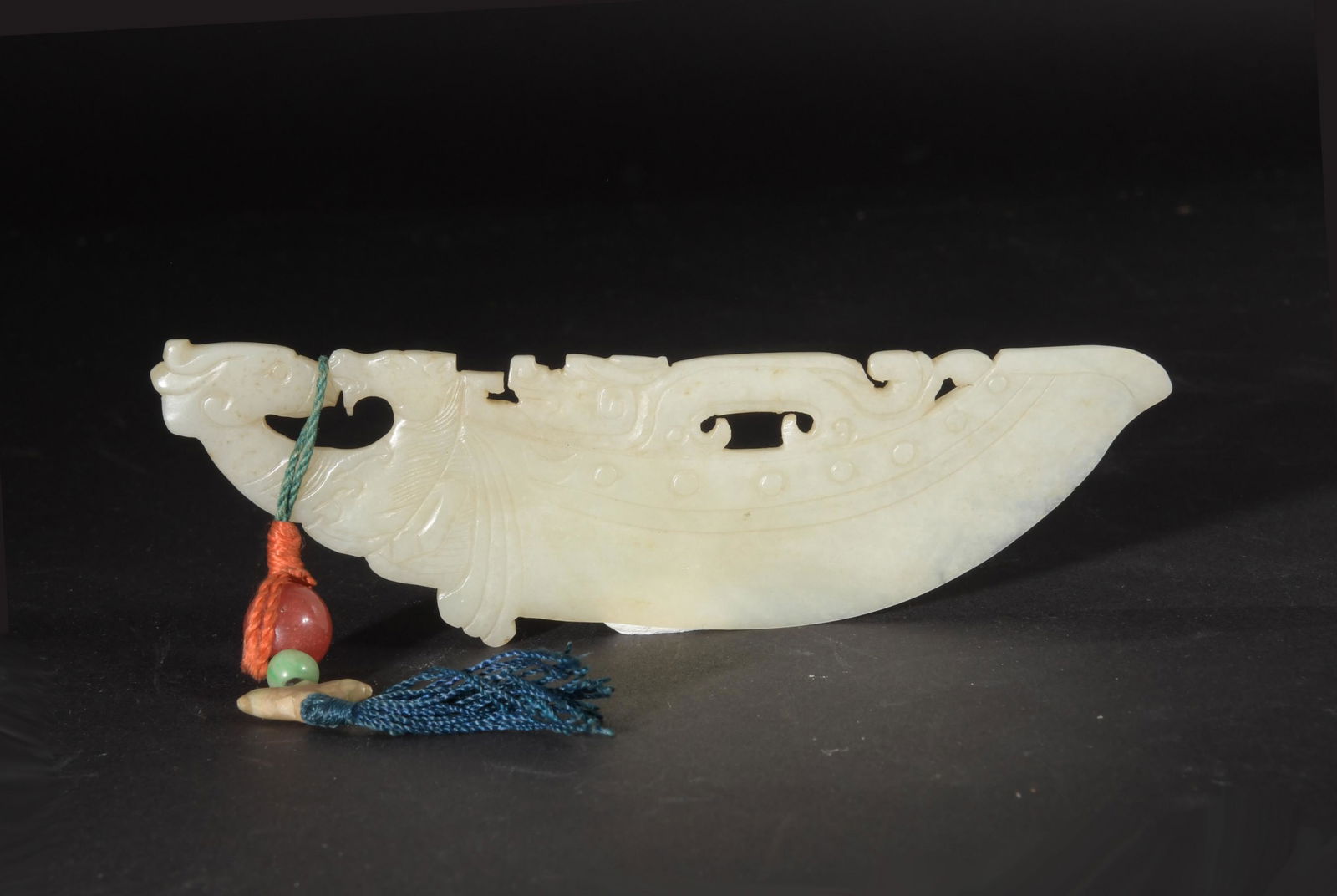 Chinese White Jade Carved Blade, Ming: A Chinese white jade knife blade dating from the Ming dynasty. The knife features a dragon, horse, and bird-headed beast. Dimensions are: 5 1/4 inches tall X 1 1/2 inches wide, 13.3 cm tall X 3.8 cm w