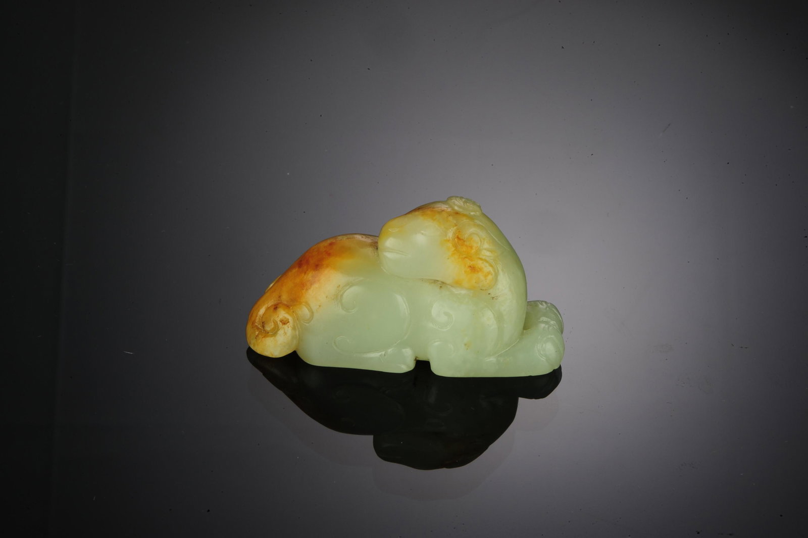 Chinese White Jade Sheep Carving, Ming Dynasty: A Chinese white jade with skin carving of a sheep, dating from the Ming Dynasty. Dimensions are: 1 1/8 inches high X 2 1/8 inches wide; 2.9 cm tall X 5.4 cm wide. All measurements are approximate. Con