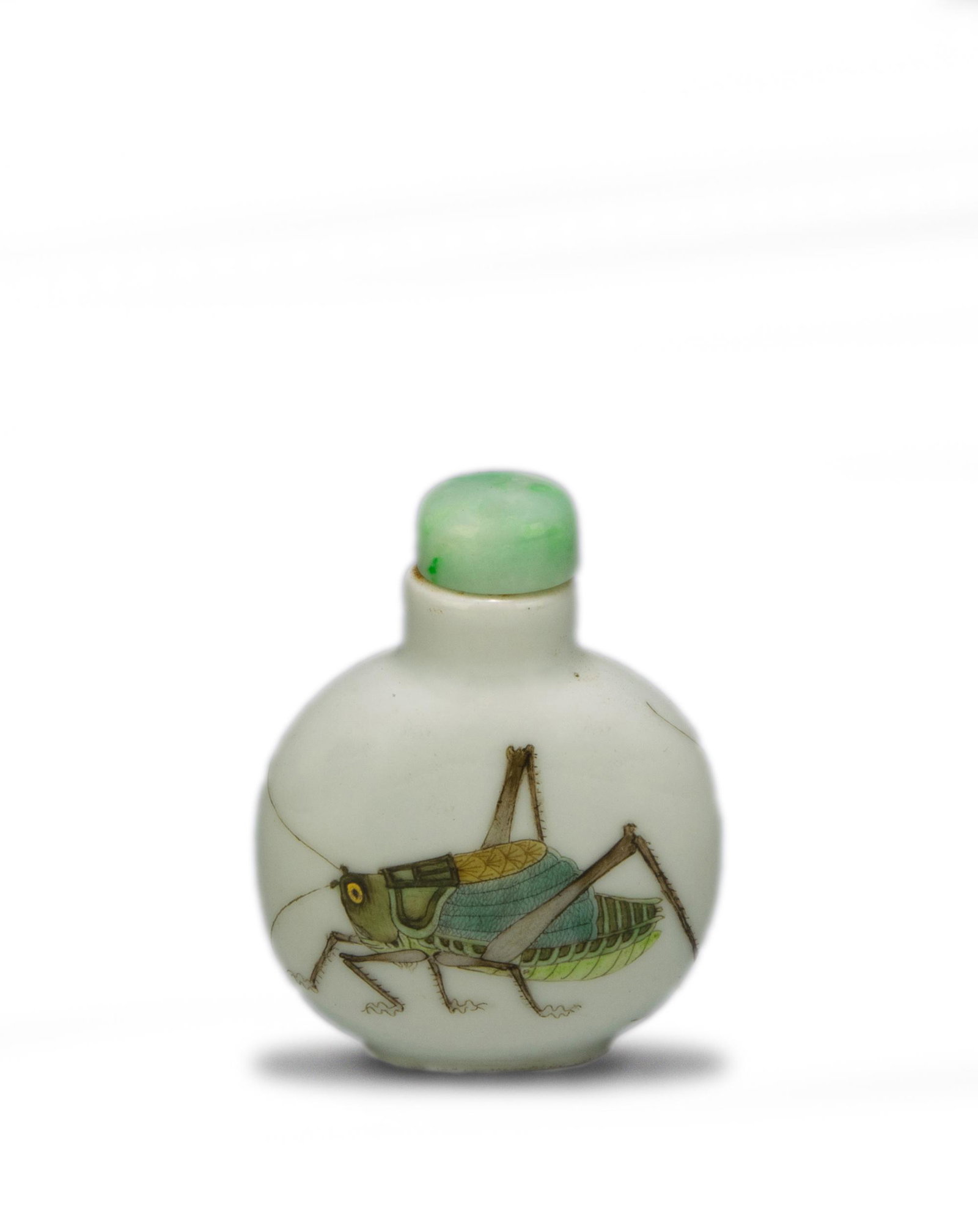 Imperial Chinese Snuff Bottle with Crickets, Daoguang: An Imperial Chinese porcelain snuff bottle with a 4-character Daoguang mark and of the period. The snuff bottle depicts 2 crickets and has a jadeite stopper. Dimensions are: 2 1/2 inches tall X 2 inch