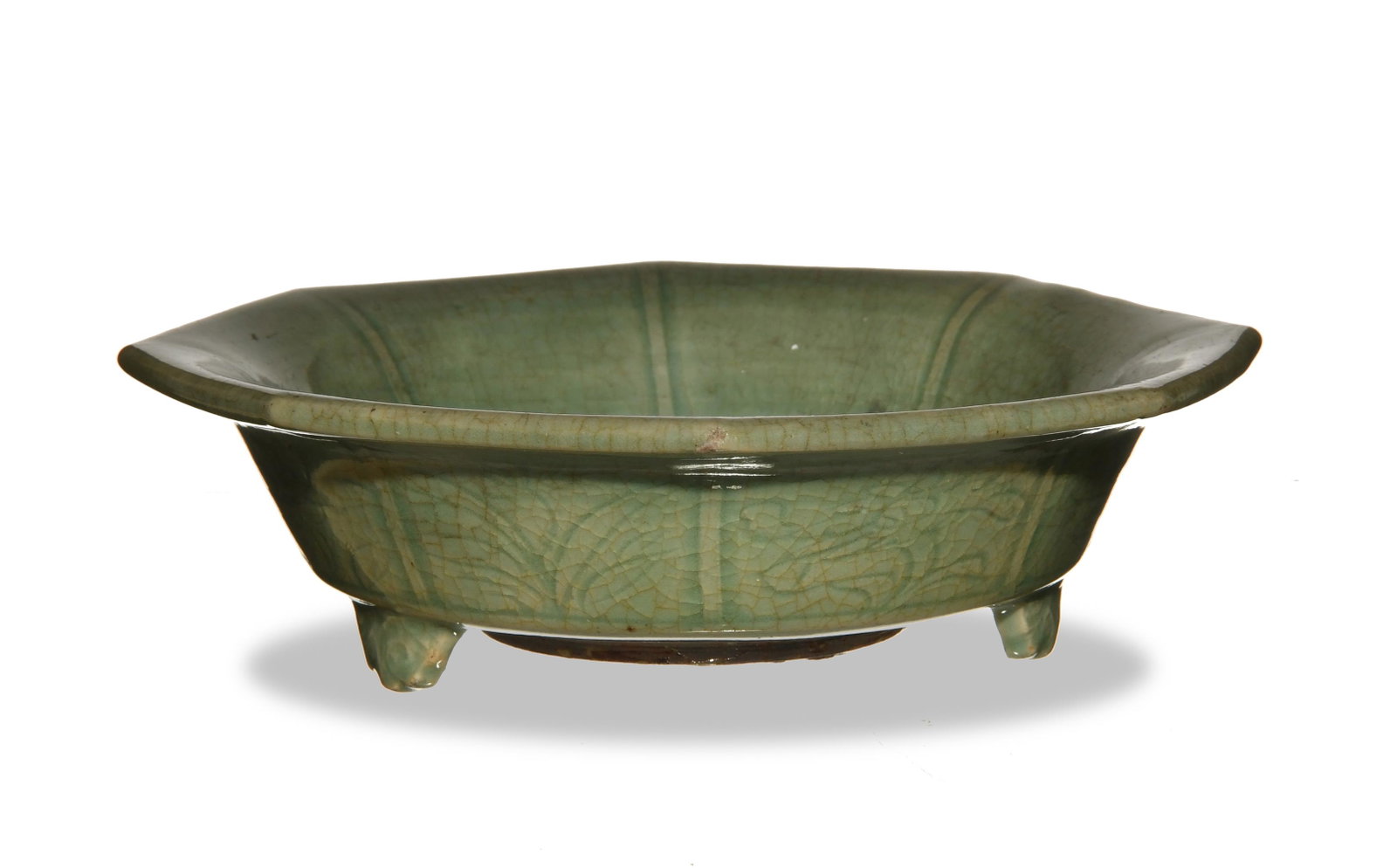 Chinese Longquan Celadon Tripod Censer, Ming: An octagonal, Chinese, longquan celadon tripod censer dating from the Ming dynasty. The exterior features underglazed flowers. Dimensions are: 2 1/4 inches tall X 8 3/4 inches wide; 5.7 cm tall X 22.2