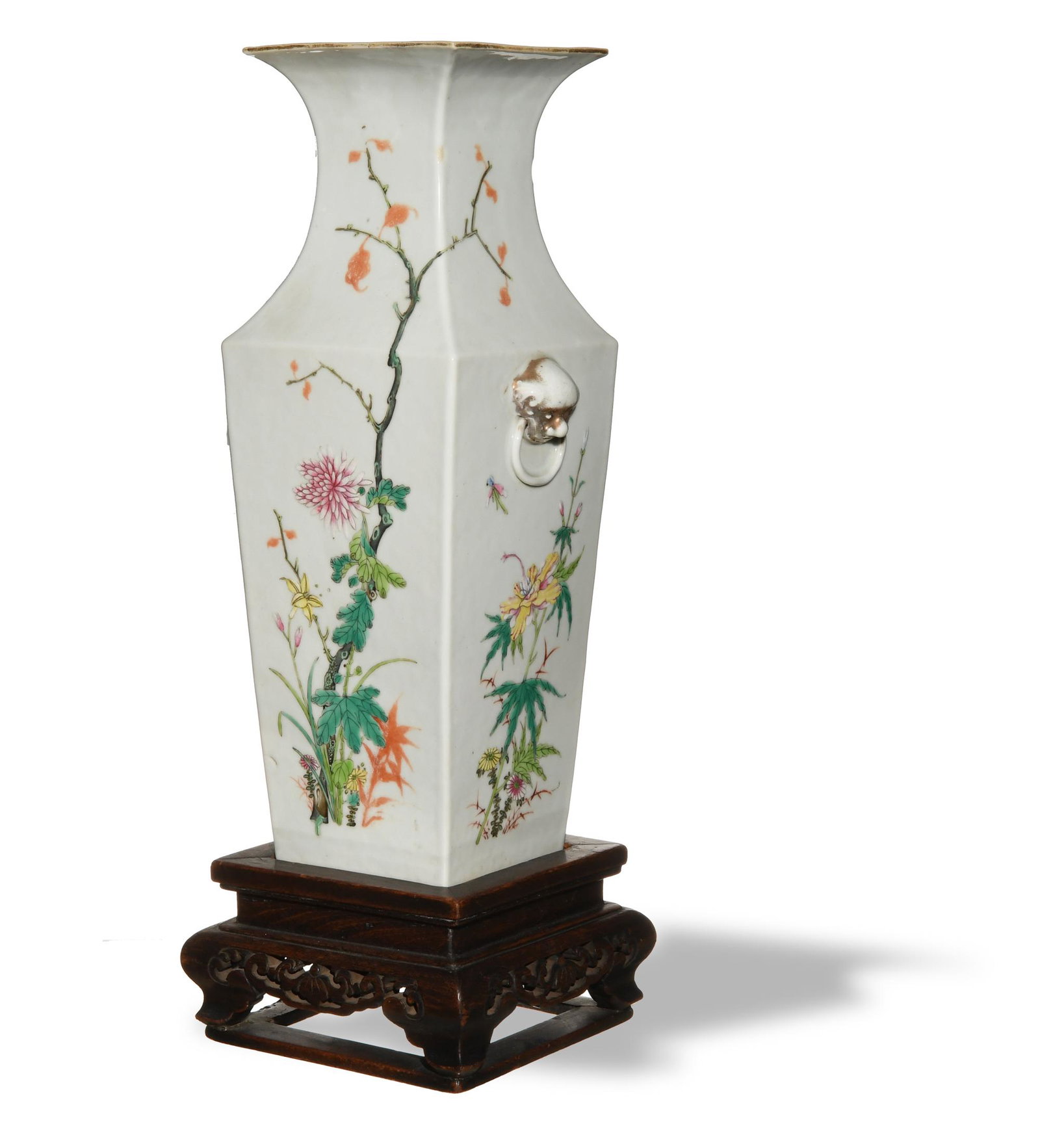Chinese Famille Rose Square Vase, Republic: A Chinese famille rose square porcelain vase dating from the Republic period, with a wooden stand. The vase features flowering branches and beast-head handles with engaged rings. The bottom of the vas