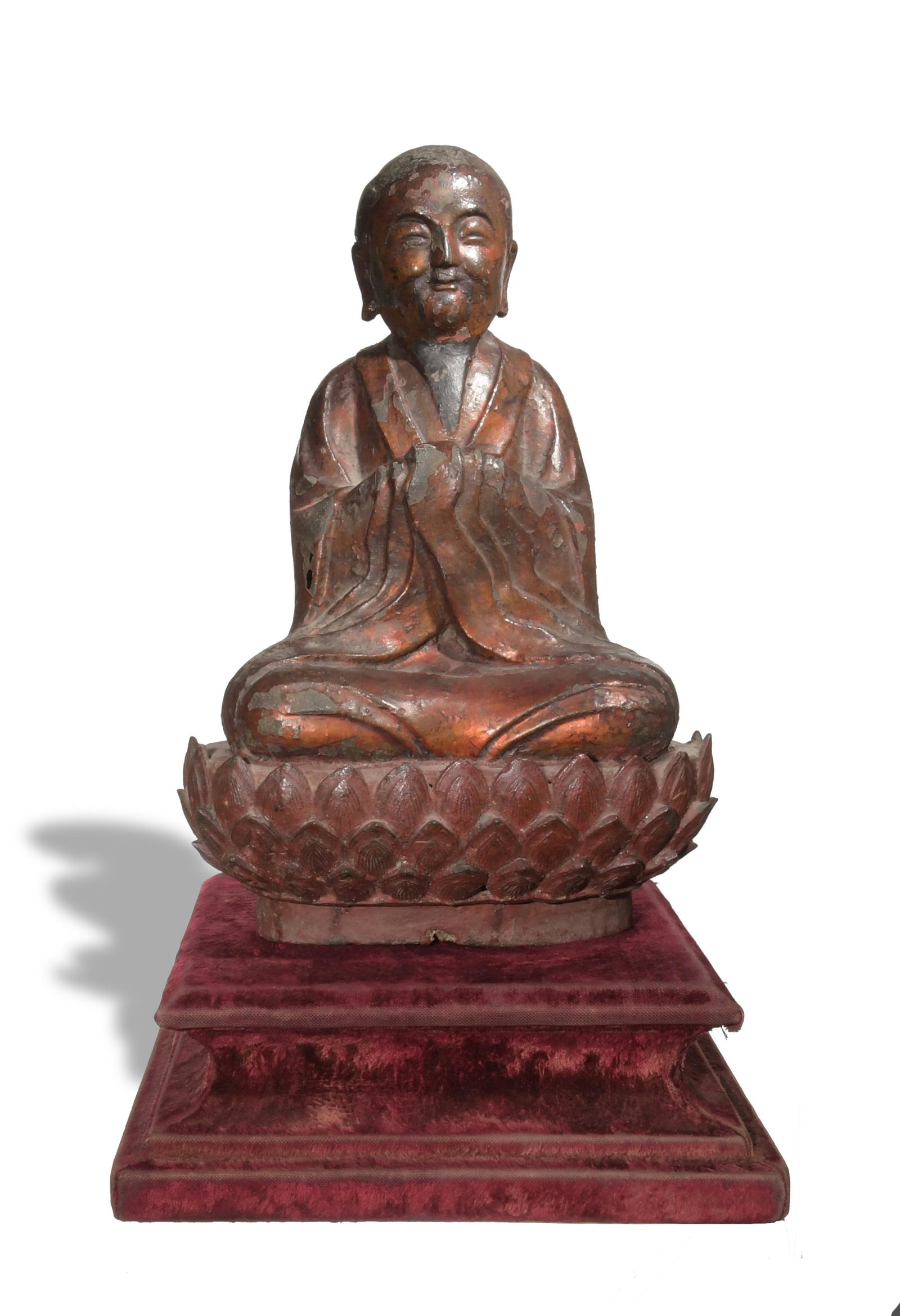 Chinese Gilt Lacquered Bronze Statue of Monk, Ming: A Chinese gilt and lacquered bronze statue of a seated monk dating from the Ming dynasty. The monk is seated on a lotus pedestal with a red velvet stand. Dimensions are: 11 1/2 inches tall X 8 inches 