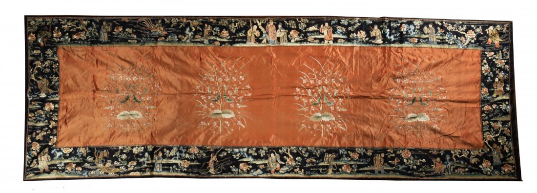 Chinese Silk Tablecloth, 19th Century: A Chinese silk tablecloth dating from the 19th century. The table cloth features an orange center containing 4 flowering branches. The border depicts a black landscape with many figures, bats, floweri