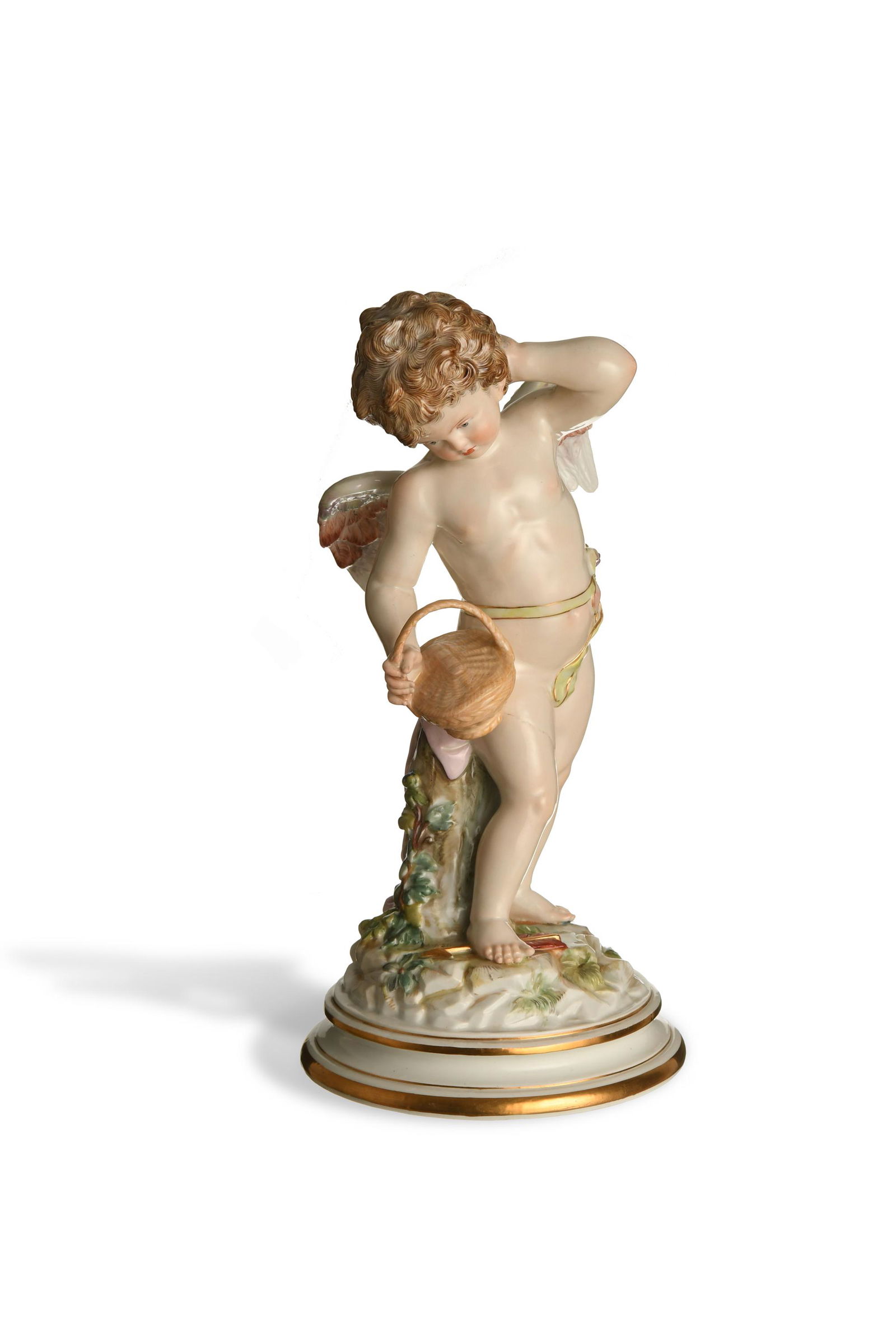 Meissen, Cupid with Basket, Model M113: Meissen (German, founded 1710) porcelain. Designed by Heinrich Schwabe, featuring a standing cupid with a basket. It is stamped with the Meissen mark, model number, and '45' on the base. Dimensions: 1