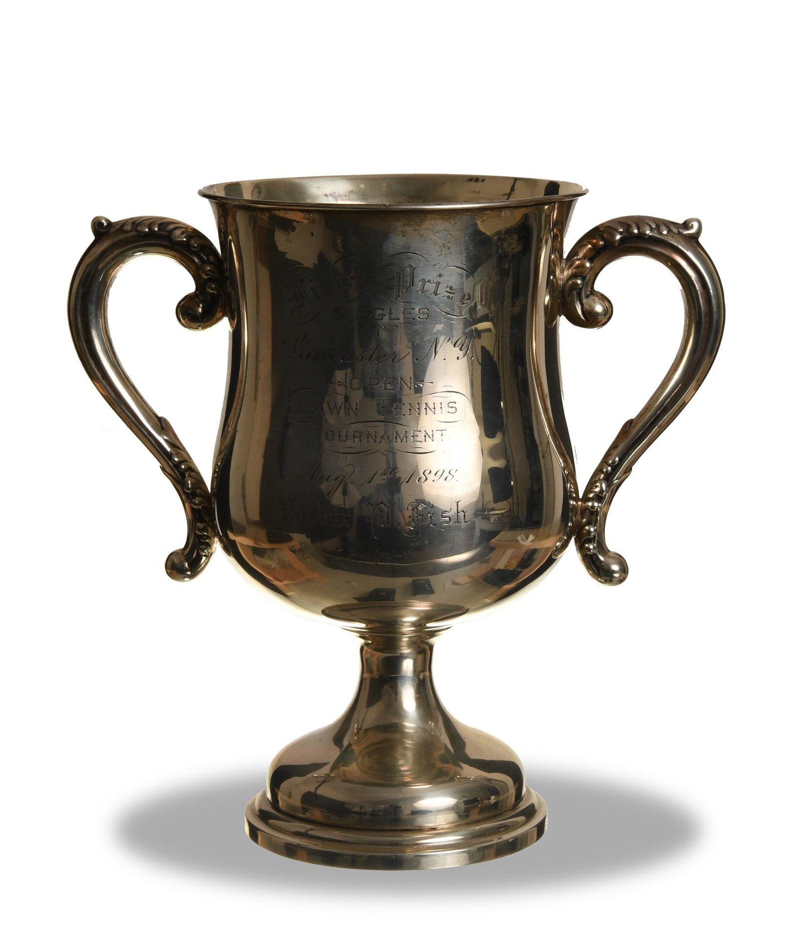 Dominick and Haff, Sterling Silver Tennis Trophy: Dominick and Haff (American, 1872-1928) sterling silver. A 1st prize Lancaster, NY Open Lawn Tennis trophy dating from 1898 and awarded to Wilbur P. Fish. The bottom is marked Sterling. Dimensions: 9 