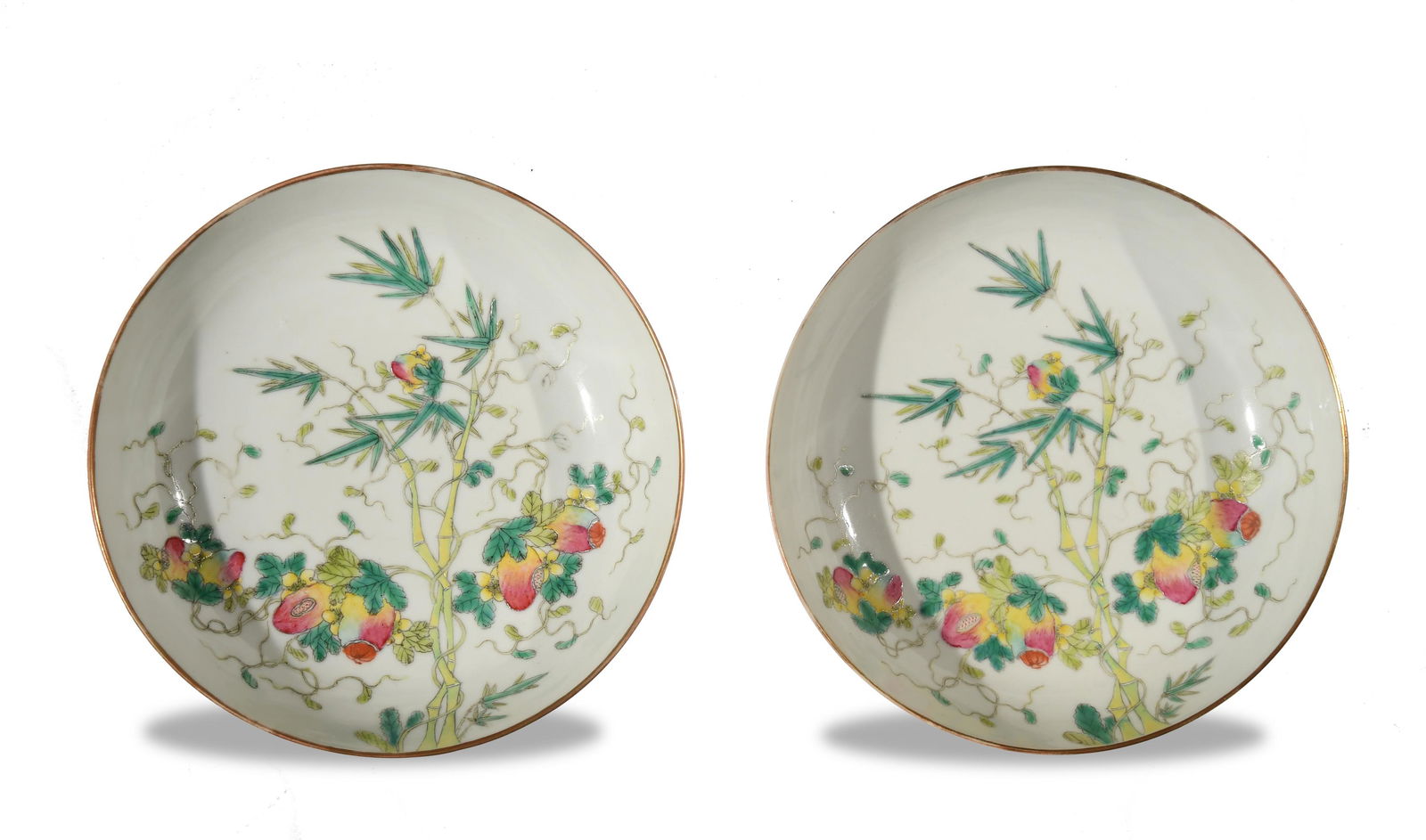 Pair of Chinese Imperial Plates, Late 19th Century: A pair of Imperial Chinese famille rose plates dating to the late 19th century. The interiors feature pomegranates and bamboo, the exterior of each depicts 3 bats. The bottoms have 6-character Guangxu