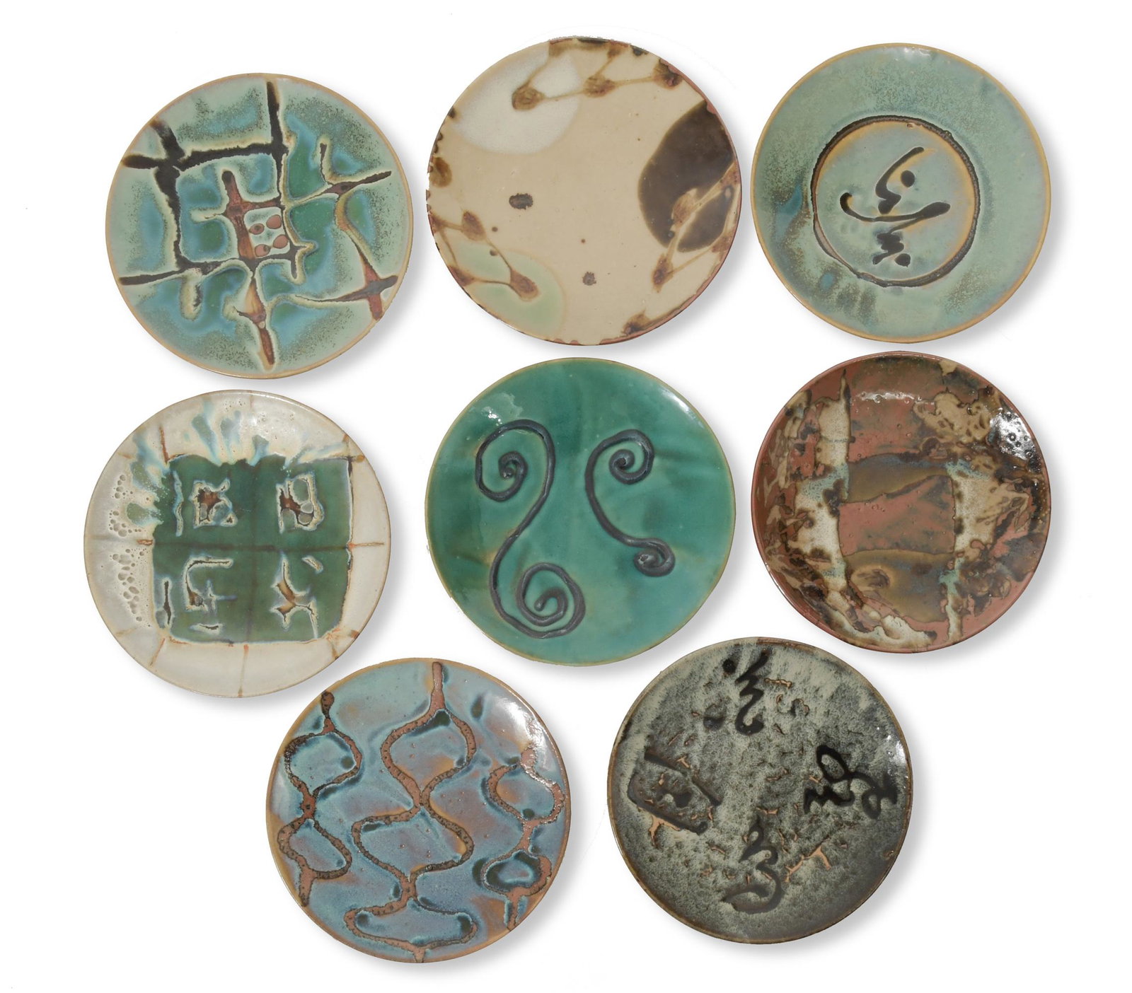8 Japanese Mashiko Ware Pottery Plates: Manner of and possibly by Hamada Shoji (Japanese, 20th century) pottery. A group of 8 plates of various designs. 1 plate is marked on the bottom. Dimensions: 1 3/4 inches tall X 11 1/8 inches diameter