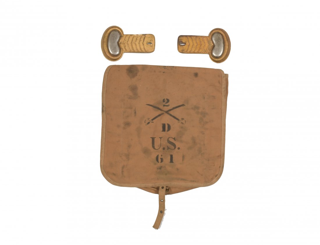 Cavalry Knapsack and Epaulettes, Indian Wars Period: A Rock Island Arsenal knapsack, dating to the Spanish-American War and marked '2nd cavalry Co. D, U.S. G1;' a pair of brass and nickel cavalry epaulettes. Dimensions: 15 inches tall X 14 1/2 inches wi