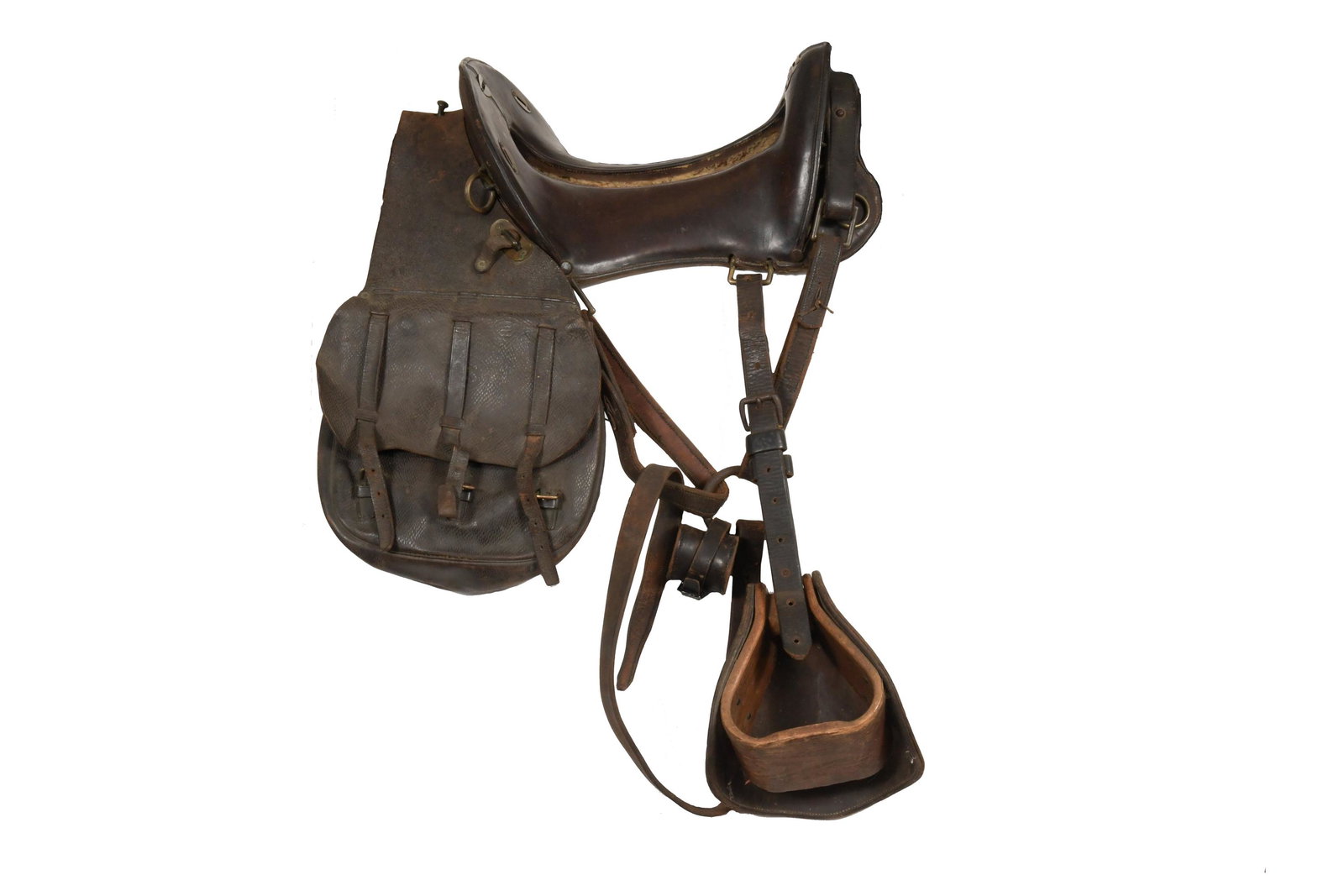 M1874 McClellan Saddle and Accessories: Complete with stirrups, cinch straps, carbine socket, and saddle-bags. The saddle-bag is marked 'Schultz' and '280.' Dimensions: 34 inches tall X 23 inches wide; 86.4 cm tall X 58.4 cm wide. All measu