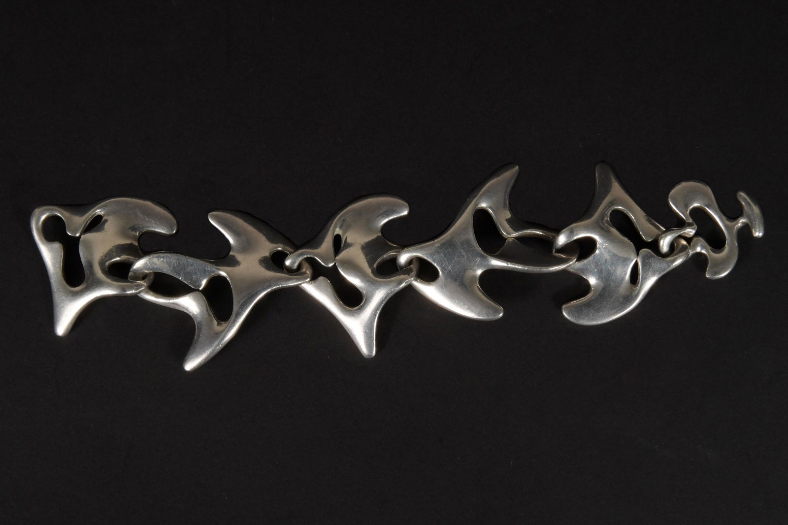 Georg Jenson, Sterling Silver Amoeba Bracelet, #89: Georg Jensen (Danish, 1866) and Henning Koppel (Danish, 1918) sterling silver. Bracelet designed by Henning Koppel, hallmark dates it to post-WWII. Marked 'Georg Jenson, Sterling, Denmark, HK, and 89'