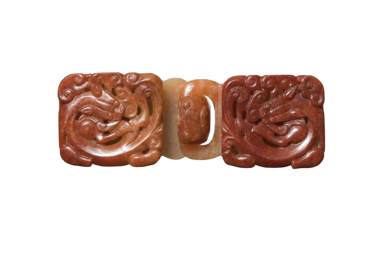 Chinese Red Jadeite Belt Buckle, 18-19th Century: A Chinese 2-part red jadeite belt buckle dating from the 18th to the 19th century. Both pieces feature a carved dragon. Dimensions: 1 1/4 inches tall X 4 inches wide; 3.2 cm tall X 10.2 cm wide. All m