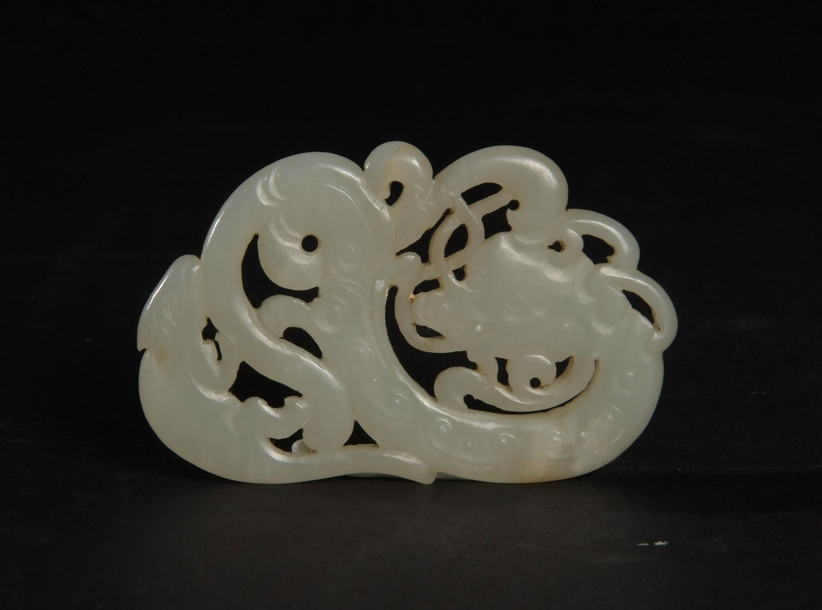 Chinese White Jade Pendant of Dragon, 18-19th Century: A Chinese white jade pendant dating from the 18th to the 19th century. The pendant features a dragon and a rat. Dimensions: 1 3/4 inches tall X 2 3/4 inches wide; 4.4 cm tall X 7 cm wide. All measurem