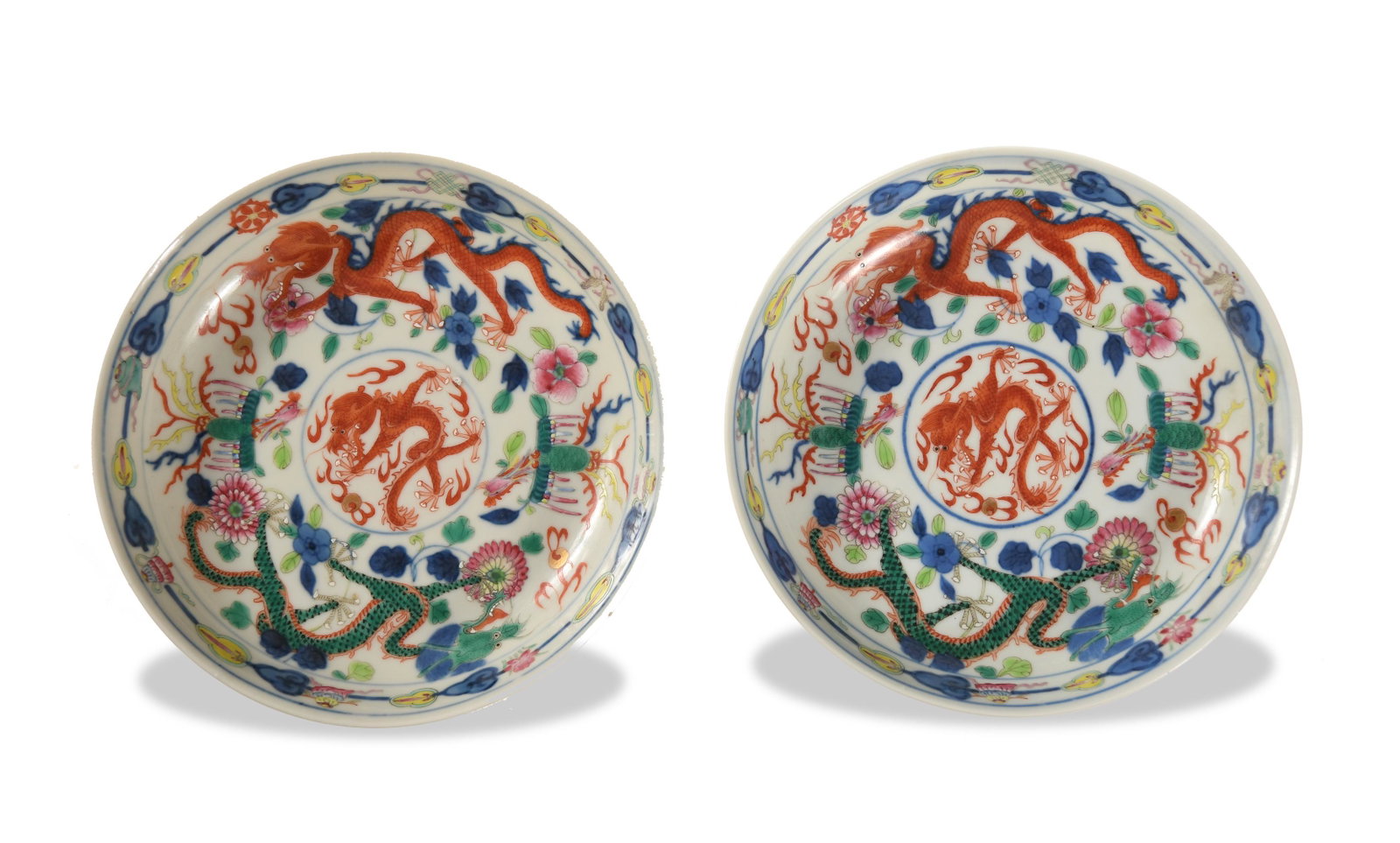Pair of Imperial Chinese Wucai Bowls, Tongzhi: A pair of Imperial Chinese blue and white with wucai bowls featuring a Tongzhi mark and of the period. The bowls feature green and red dragons with 2 phoenix around a red dragon roundel. Dimensions: 1