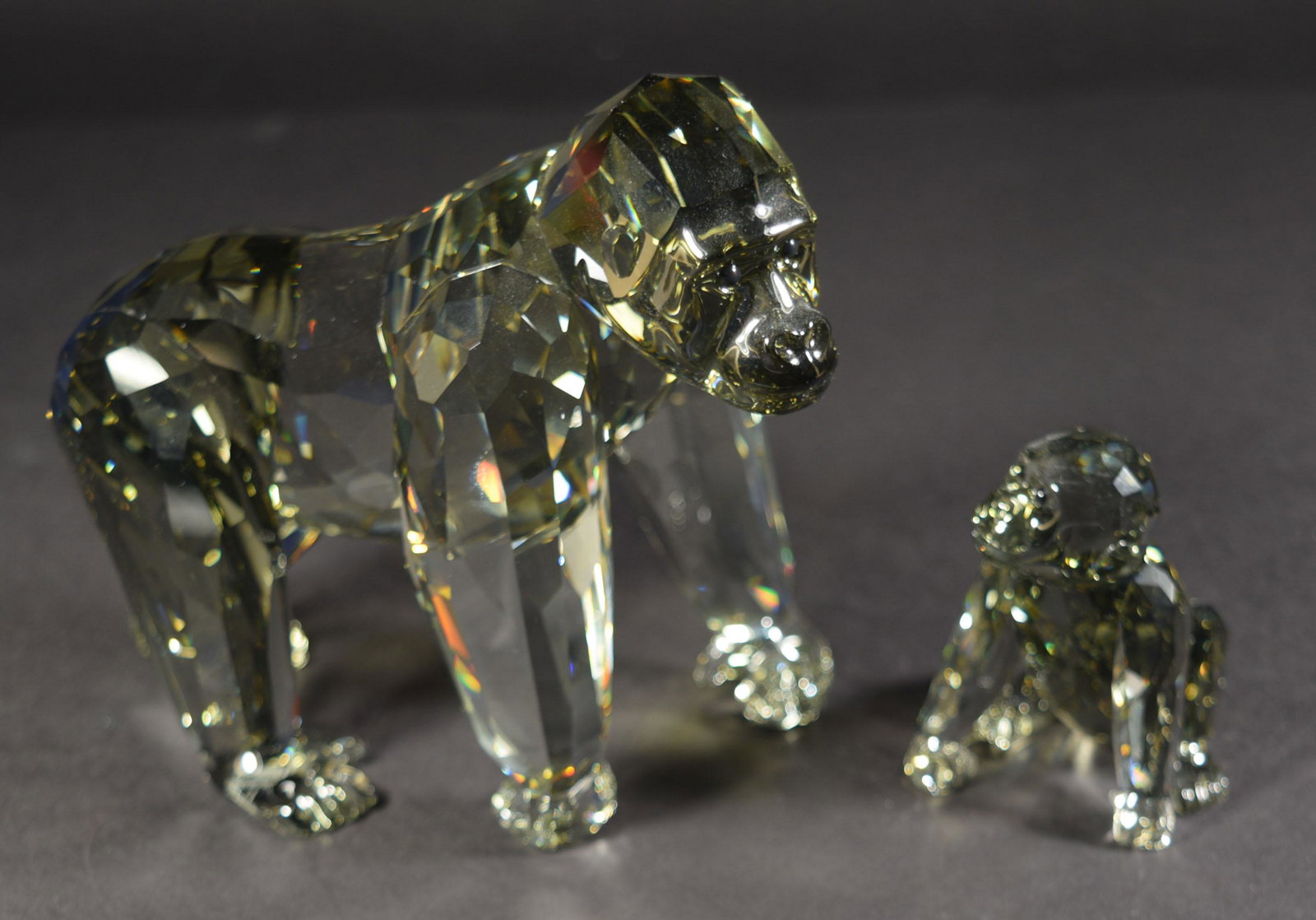 2 Boxed Swarovski SCS Gorillas inc. Endangered: Swarovski (Austrian, founded 1895) crystal. A set of SCS crystal gorilla figurines including a gorilla cub and the Endangered Wildlife Gorillas designed by Anton Hirzinger in 2009 featuring a cub and 