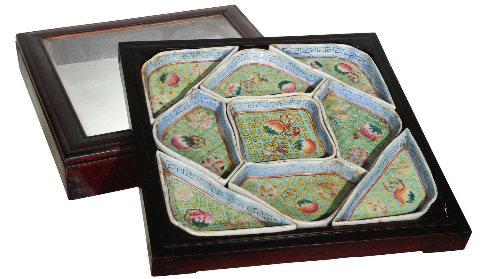 Chinese Porcelain Sectional Dishes, 19th Century: A Chinese porcelain sectional dish set dating from the 19th century. Includes 9 pieces featuring fruit and flowers. All are stamped on the bottom and housed in a wooden box with a clear lid. Dimension