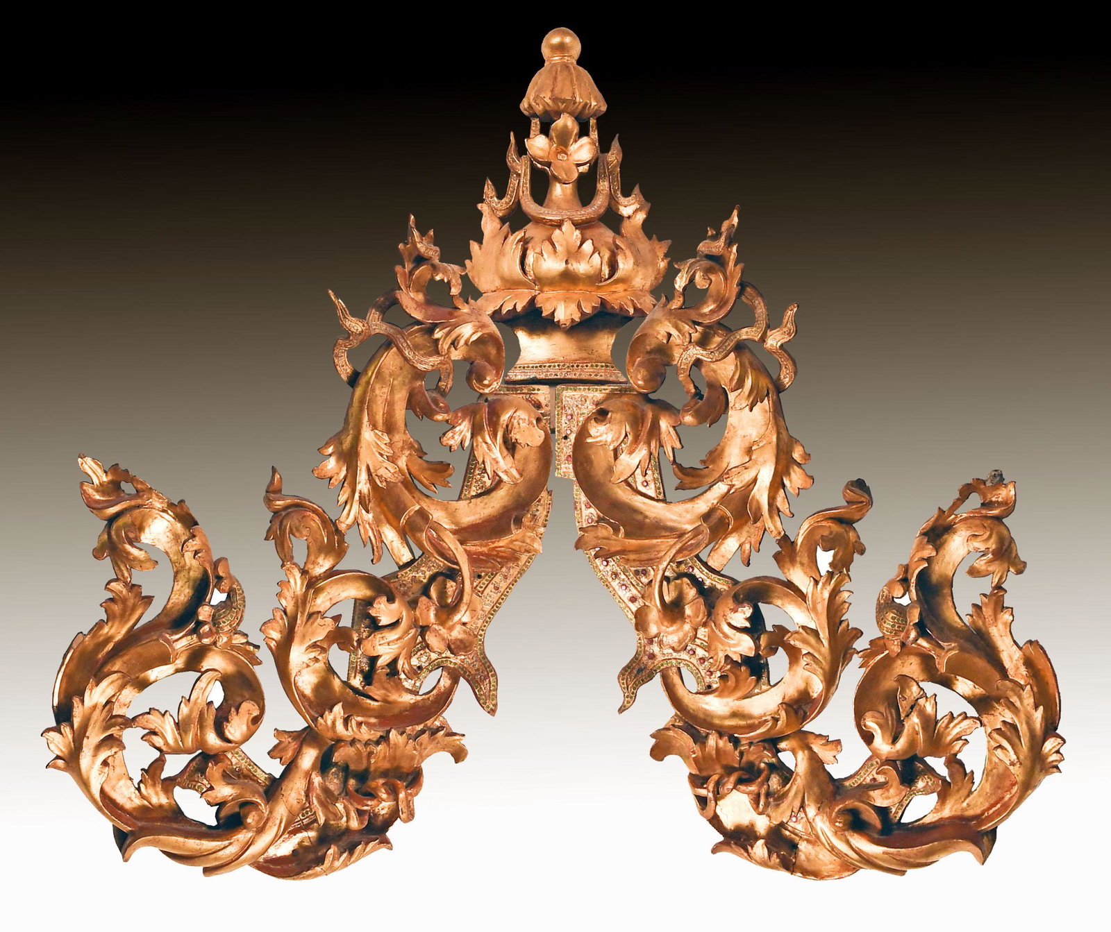 Carved and Painted Thai Temple Pediment, 19th Century: A carved, red-and-gold painted Thai temple pediment dating from the 19th century. The pediment is in three pieces: one central piece with two flanking pieces. The pediment features green, silver and r