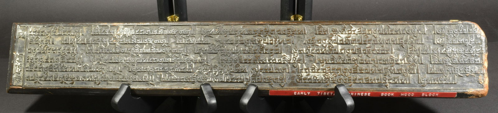 Chinese Tibet Book Wood Block: An Early Tibetan and Chinese wood block book. Carved wood block featuring Chinese and Tibetan calligraphy. Carved on two sides. Dimensions: 18 7/8 inches long X 3 inches tall; 47.9 cm long X 7.6 cm ta