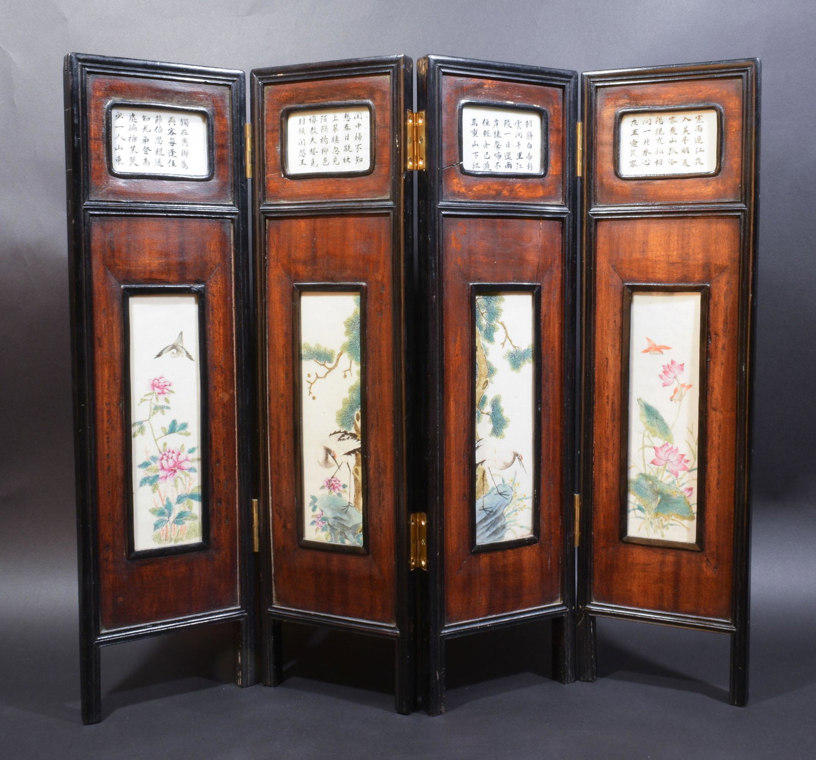 Chinese 4-Panel Table Screen, Republic Period: A 4-panel folding table screen inset with famille rose porcelain panels and dating from the Republic period. Each panel features 2 plaques: one depicts birds and flowers and the other features a poem.