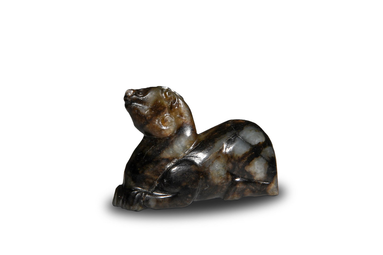 Chinese Jade Carved Beast Toggle, Ming: A Chinese jade carved beast toggle dating to the Ming dynasty or earlier. Dimensions are: 1 3/8 inches tall X 2 inches wide, 3.5 cm tall X 5.1 cm wide. All measurements are approximate. Condition: Ove