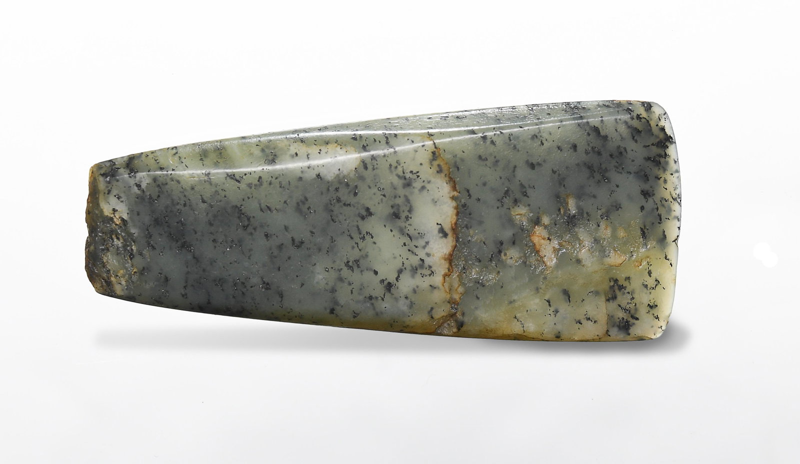 Chinese Jade Axe Blade, Hongshan Culture: A Chinese jade axe blade dating from the Hongshan culture. Dimensions are: 5 1/4 inches tall X 2 1/4 inches wide, 13.3 cm tall X 5.7 cm wide. All measurements are approximate. Condition: Age-appropria
