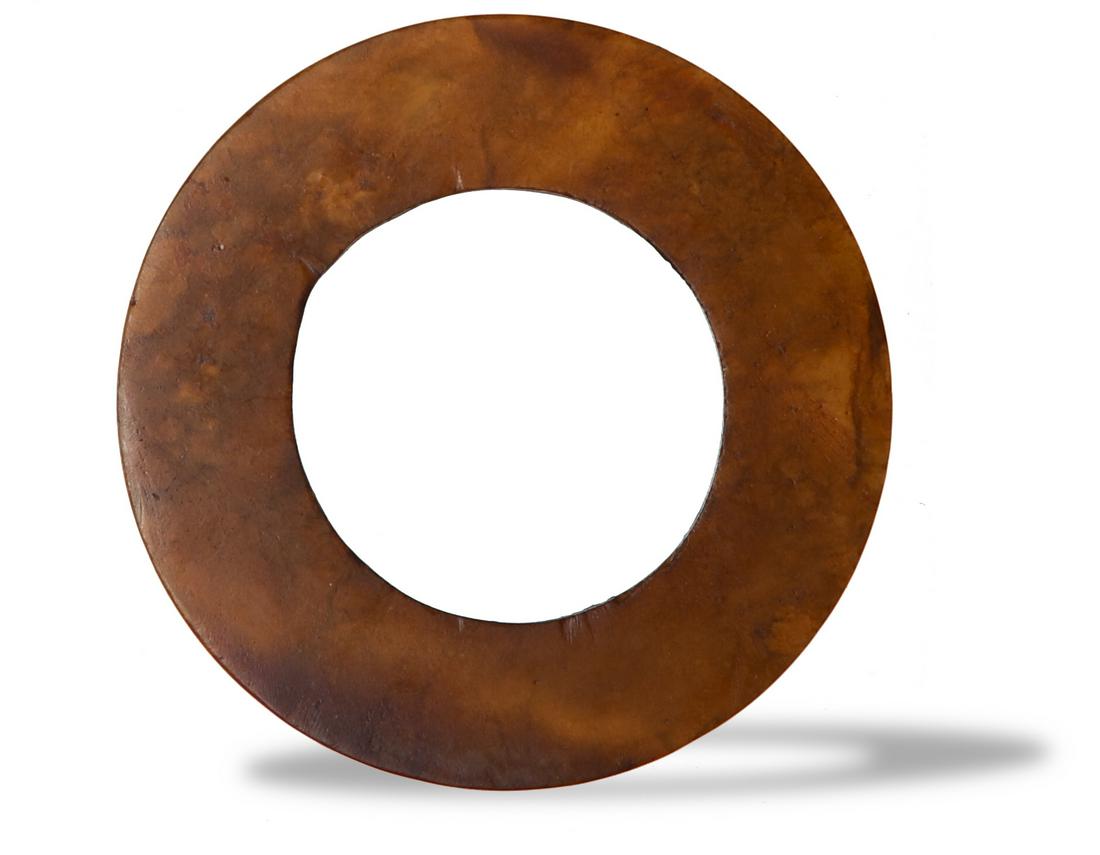 Chinese Jade Huan, Shang or Western Zhou: A Chinese jade huan disc dating from the Shang or Western Zhou dynasties. Dimensions are: 2 1/4 inches tall X 1/8 inches wide, 5.7 cm tall X 0.3 cm wide. All measurements are approximate. Condition: A
