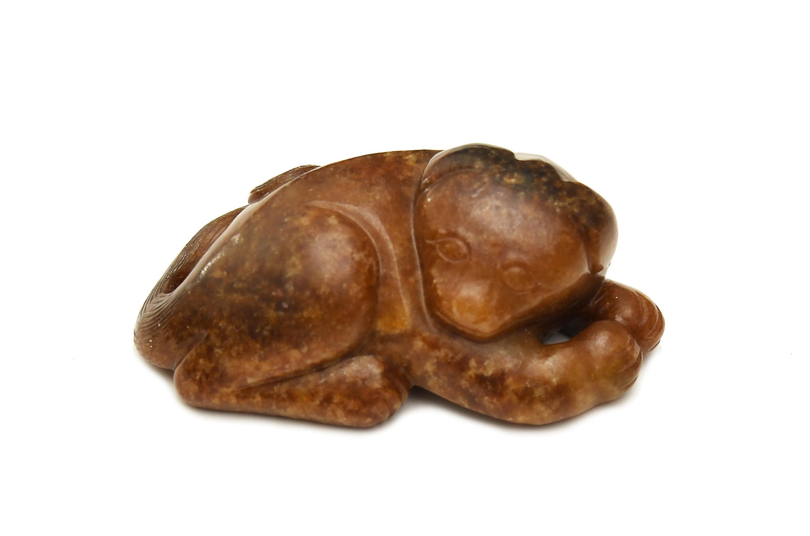Chinese Brown Jade Dog, Ming: A Chinese brown jade dog dating to the Ming dynasty. Dimensions are: 3 in. tall X 1 2/3 in. wide; 7.6 cm tall X 4.2 cm wide. All measurements are approximate. Condition: It is in good condition. To vi