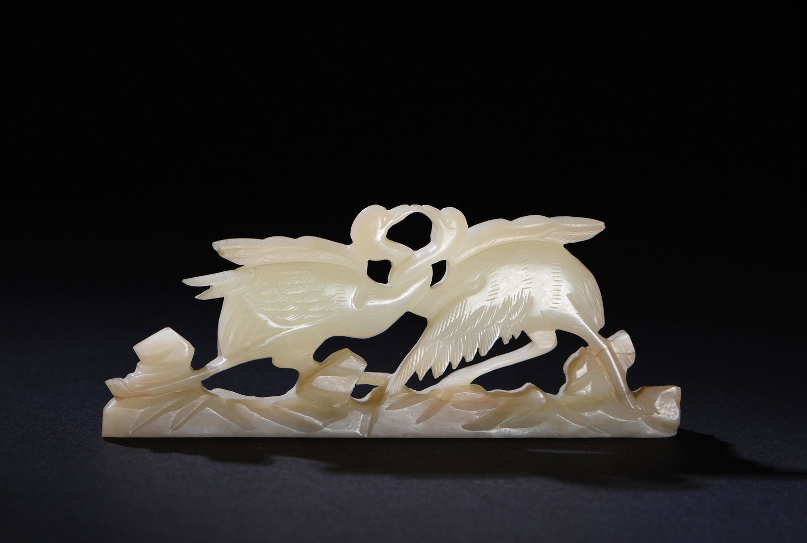Chinese Carved White Jade Brush Rest, Ming: A Chinese white jade brush rest dating from the Ming dynasty. The brush rest features a carving of 2 cranes. Dimensions are: 2 inches tall X 4 1/2 inches wide, 5.1 cm tall X 11.4 cm wide. All measurem