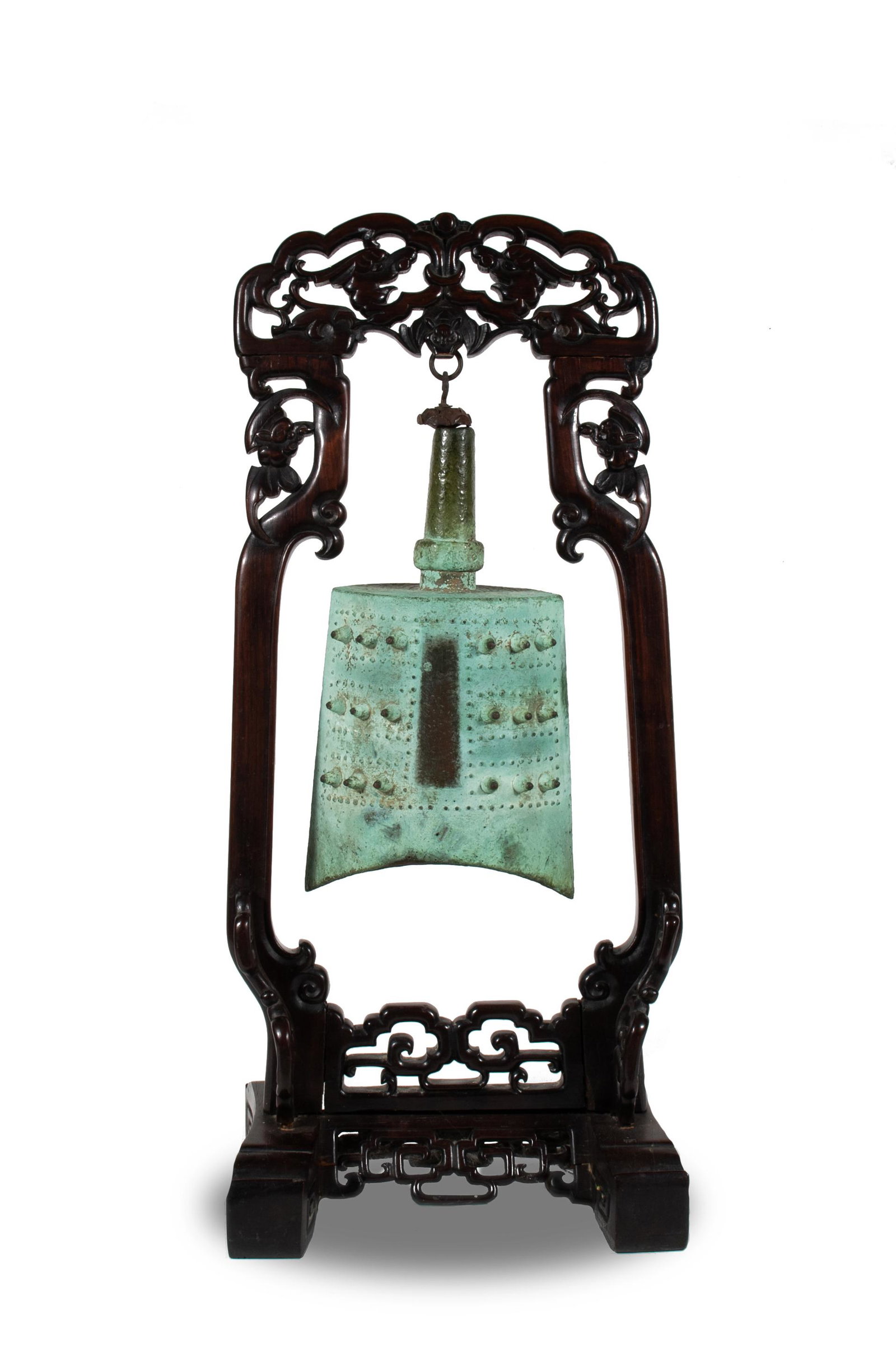Chinese Bronze Bell, Eastern Zhou-Spring and Autumn: The body of elliptical section and barrel form with the two sides rising up in an arc, each side set with three rows of three bosses, evenly distributed and placed in the upper quadrants on both sides
