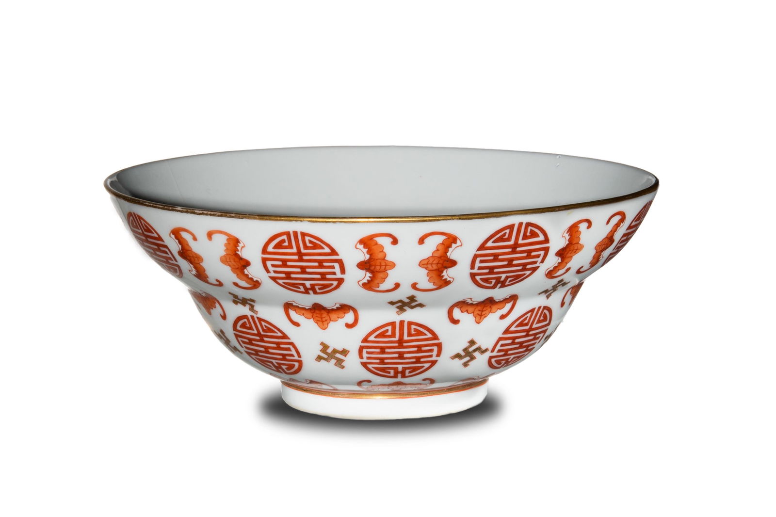 Imperial Chinese Iron Red Bowl, Daogang: An Imperial Chinese porcelain and iron red bowl with a six-character Daoguang mark and of the period. The bowl is decorated with Shou medallions, bats and Buddhist crosses. Dimensions are: 2 3/4 in. t