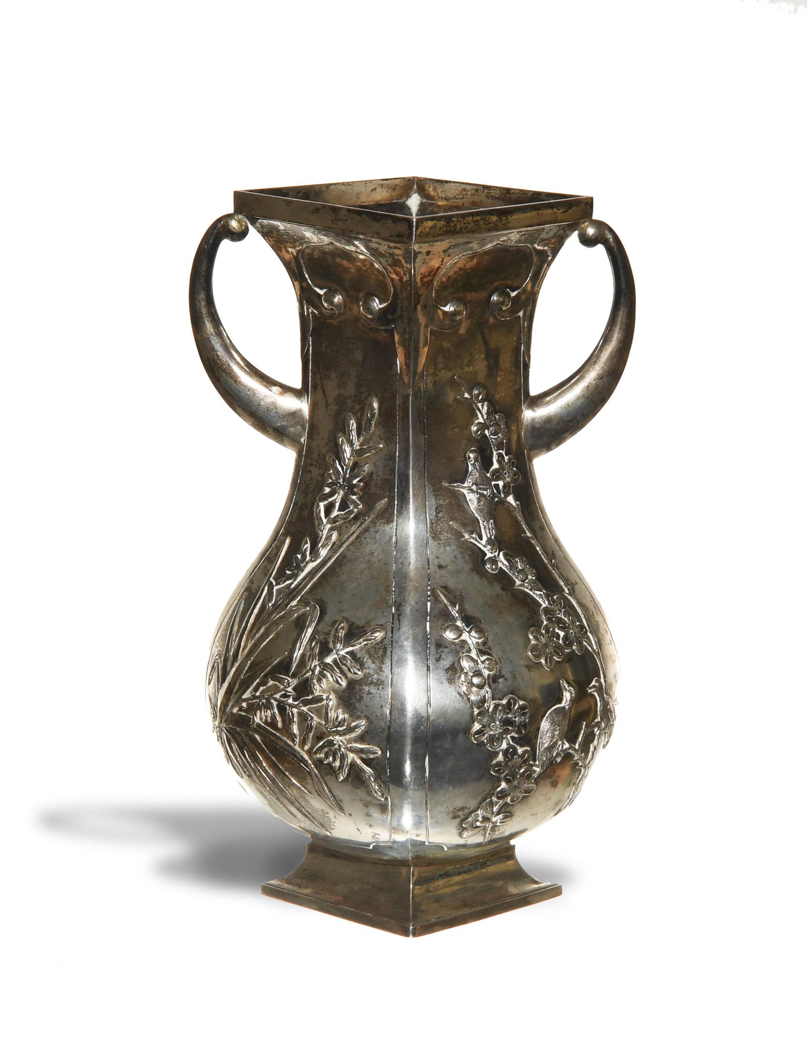 Chinese Export Silver Vase, 19th Century: A square Chinese export silver vase dating to the 19th century. The vase is stamped on the bottom with a two-character mark and the words "Sincere" and "Shanghai." The vase has two handles and depicts