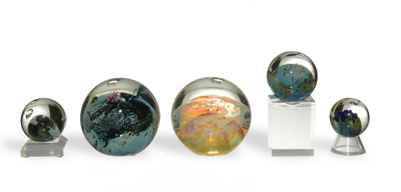 5 Josh Simpson Planets / Paperweights: Josh Simpson (American, b. 1949) glass. A group of 5 planets and paperweights; the 3 planets are miniature, the larger 2 are paperweights and are signed and dated on the bottom. Dimensions: 3 1/2 inch
