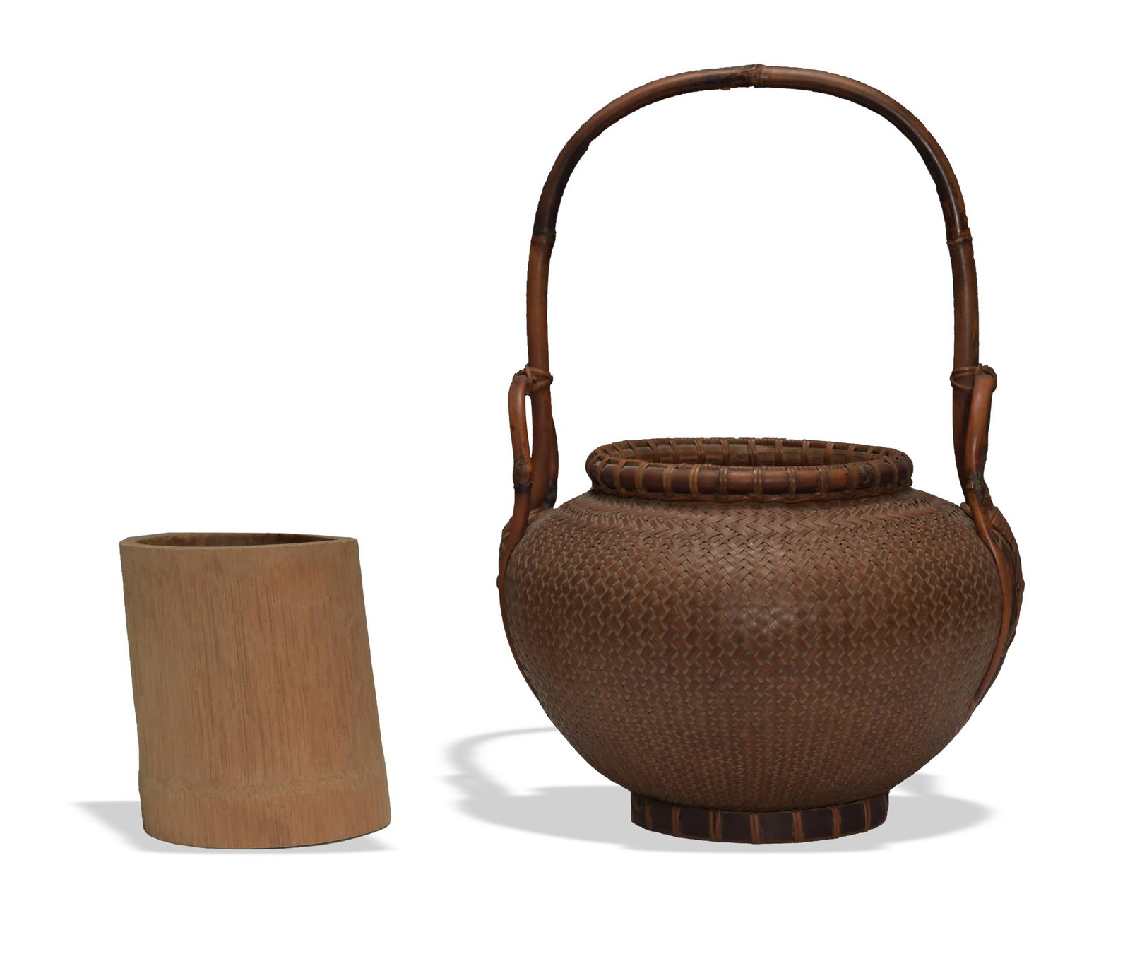 Japanese Ikebana Basket, Late Meiji: A Japanese woven basket with a handle and wooden insert, dating to the late-Meiji period. There is a 3-character signature on the bottom cross bar. Dimensions: 14 1/2 inches tall X 10 inches wide; 36.