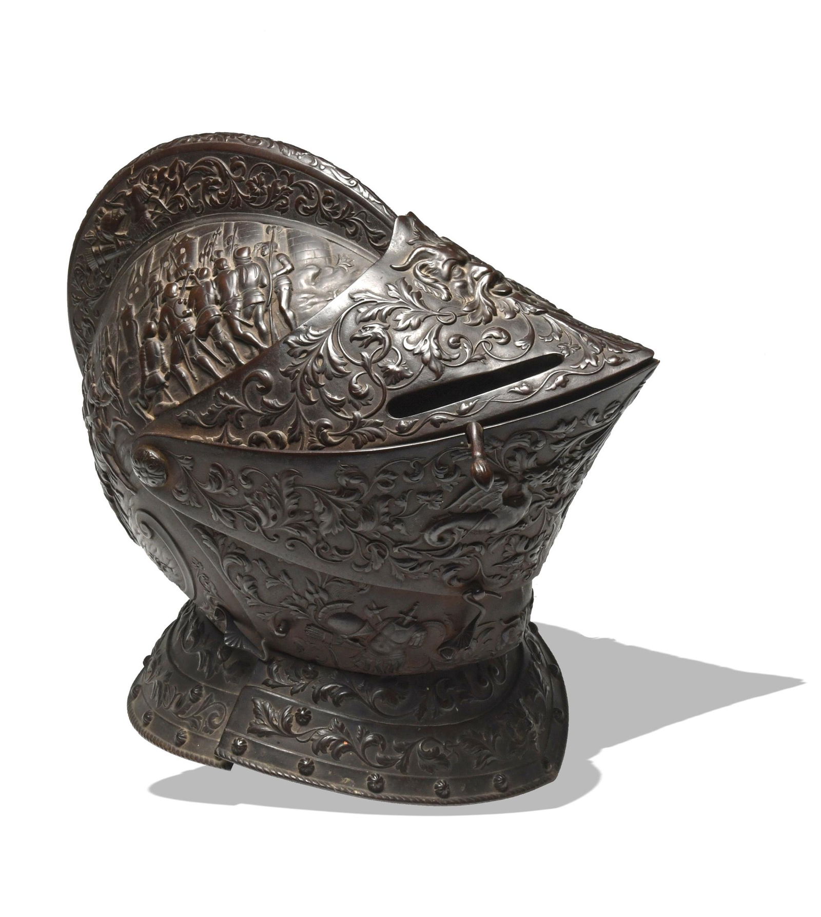 Parade Burgonet, Manner of Negroli: Manner of Filippo Negroli (Italian, 16th century) iron, 19th century. The skull features scenes with people in armor on both sides; the faceplate features floral tracery, dragons, faces, and pieces of