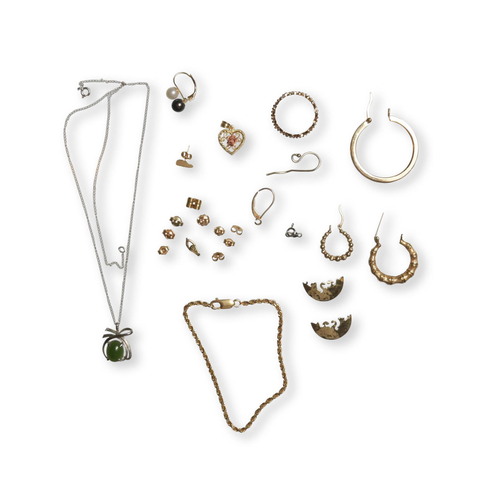 14K Scrap Gold Lot: A group of scrap gold, including a 14K white gold pendant with jadeite, one earring with a black and a white pearl, a ring, a bracelet, and earring backs. Also has two small 10K gold earrings. Dimensi