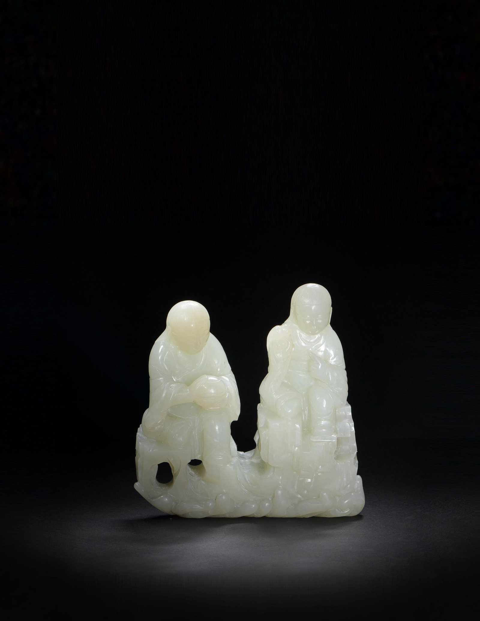 Chinese White Jade Carved Hehe Erxian Statue, 18th: A Chinese white jade statuette of Hehe Erxian dating from the 18th century. The pair of boys hold a censer and a bird. Dimensions: 5 1/4 inches tall X 5 inches wide X 2 inches deep; 13.3 cm tall X 12.