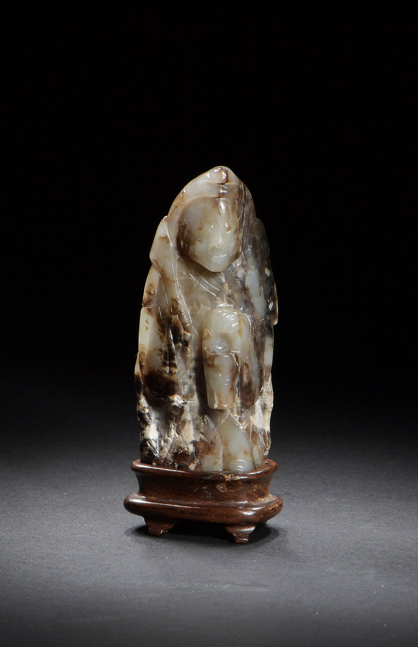 Chinese Jade Carved Figure, Ming Dynasty: A Chinese jade carving dating from the Ming dynasty. The carving depicts a shamanic figure wearing a deerskin. Dimensions: 3 3/4 inches tall X 1 1/2 inches wide; 9.5 cm tall X 3.8 cm wide. All measure