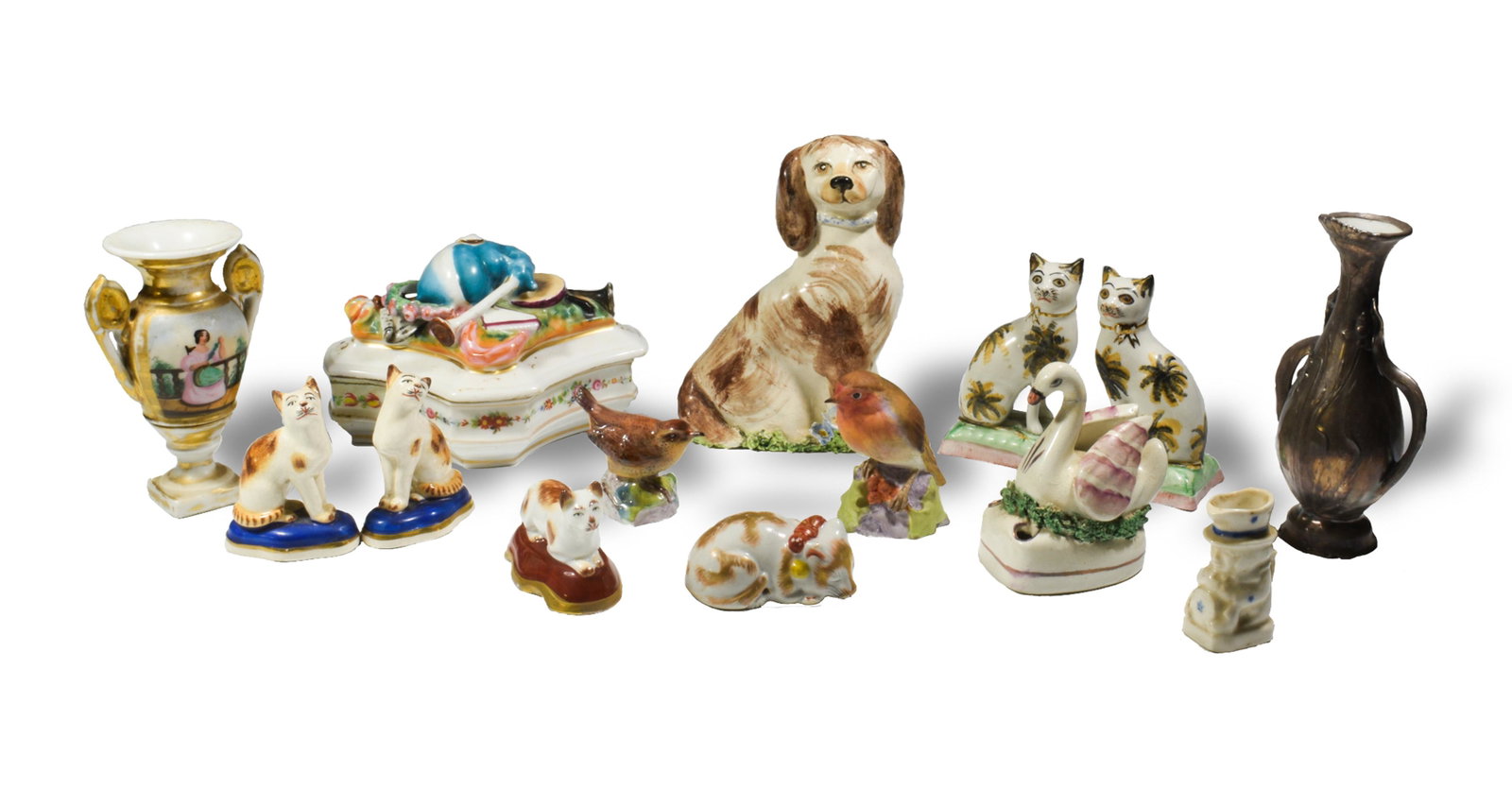 Group of 14 Porcelain Figures and Items: A mixed group of 14 porcelain items, including an unmarked Continental dresser box ornamented with a bagpipe and other instruments; an Art Nouveau vase with silver overlay; two Royal Worcester (Britis