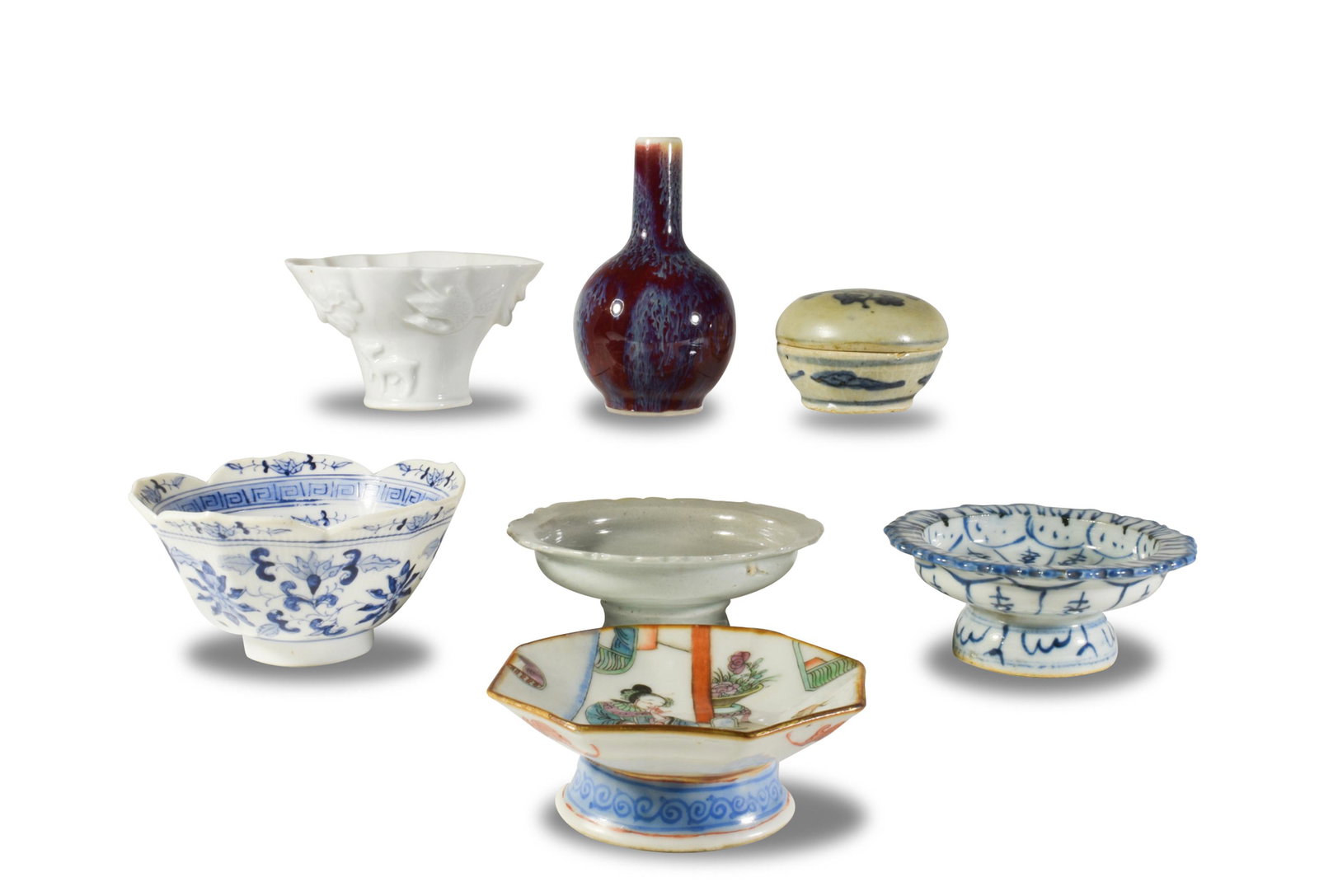 7 Pieces Chinese Porcelain, Ming and Later: A group of 7 Chinese porcelain objects dating from the Ming dynasty and later. The group includes a white glazed quatrefoil bowl featuring a dragon, crane, dog, deer, a flowering tree, and a pine tree