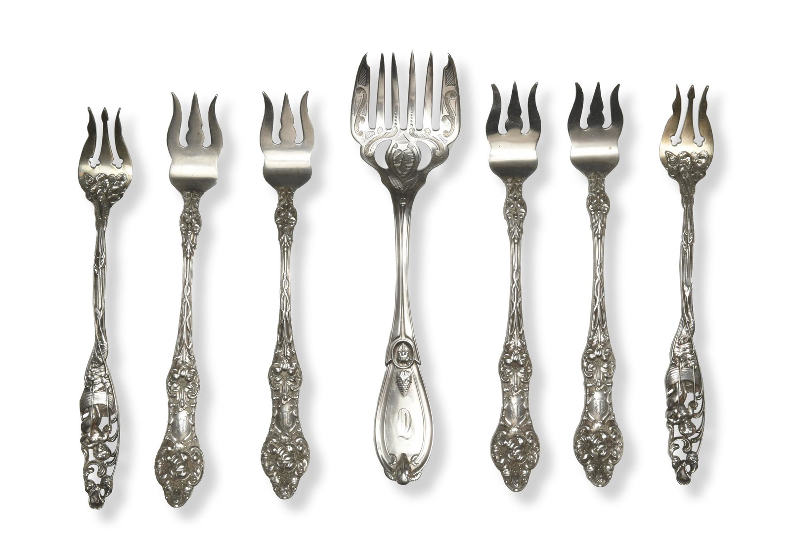Sterling Tiffany, 2 Theo. B. Starr, 4 Alvin Forks: A group of 7 sterling silver spoons. A Tiffany & Co. Grecian pattern sardine fork circa 1885; 2 Theodore Starr and Frost oyster forks depicting the labors of Cupid circa 1900; and 4 Alvin Orange Bloss