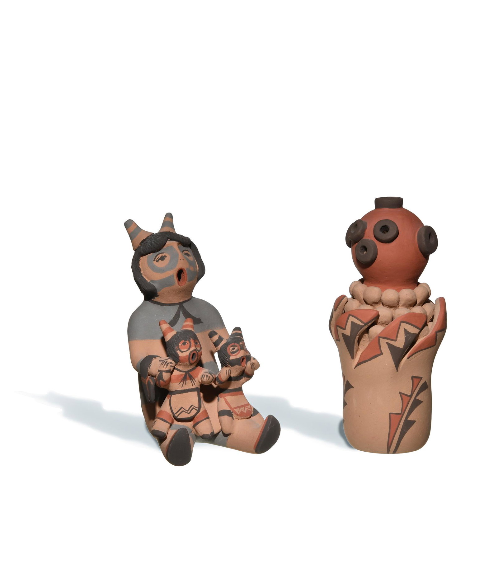 Emily Fragua Tsosie, 2 Jemez Pottery Figures: Emily â€˜Corn Pollenâ€™ Fragua Tsosie (Jemez Pueblo, b. 1951) pottery figures. Includes two figures: a storyteller with two children and a Mudhead figure. Both are signed on the base. Provena