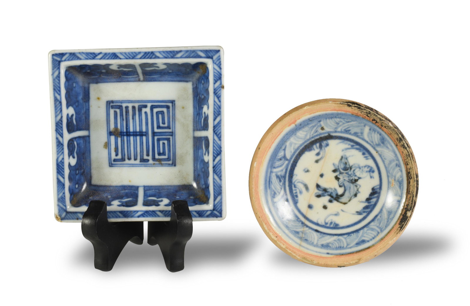 2 Chinese Blue & White Plates, Ming/Qing: Two Chinese blue-and-white porcelain plates dating from the Ming or Qing Dynasties. The square plate features a Shou character in its base. The round plate depicts a man riding a fish and a wave borde