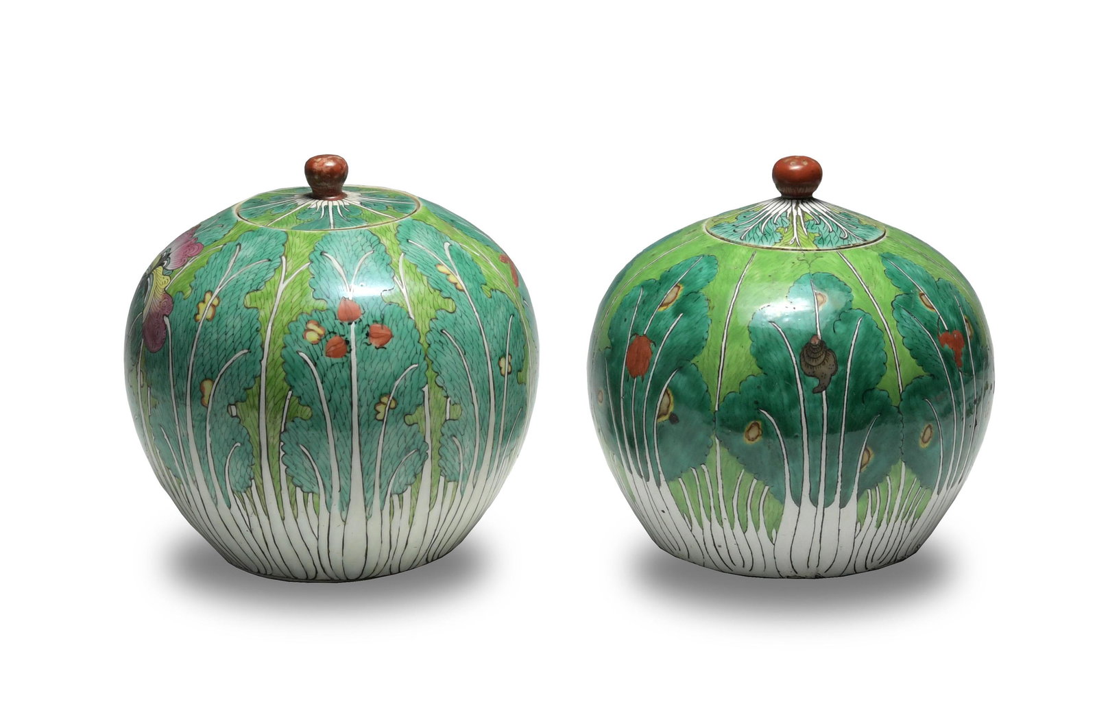Pair of Chinese Famille Rose Lidded Jars, 19th Century: A pair of famille rose lidded jars with bok choy design with insects, butterflies, bats, and snails. Dimensions are: 9 1/4 inches tall X 8 7/8 inches diameter; 23.4 cm tall X 22.5 cm diameter. All mea