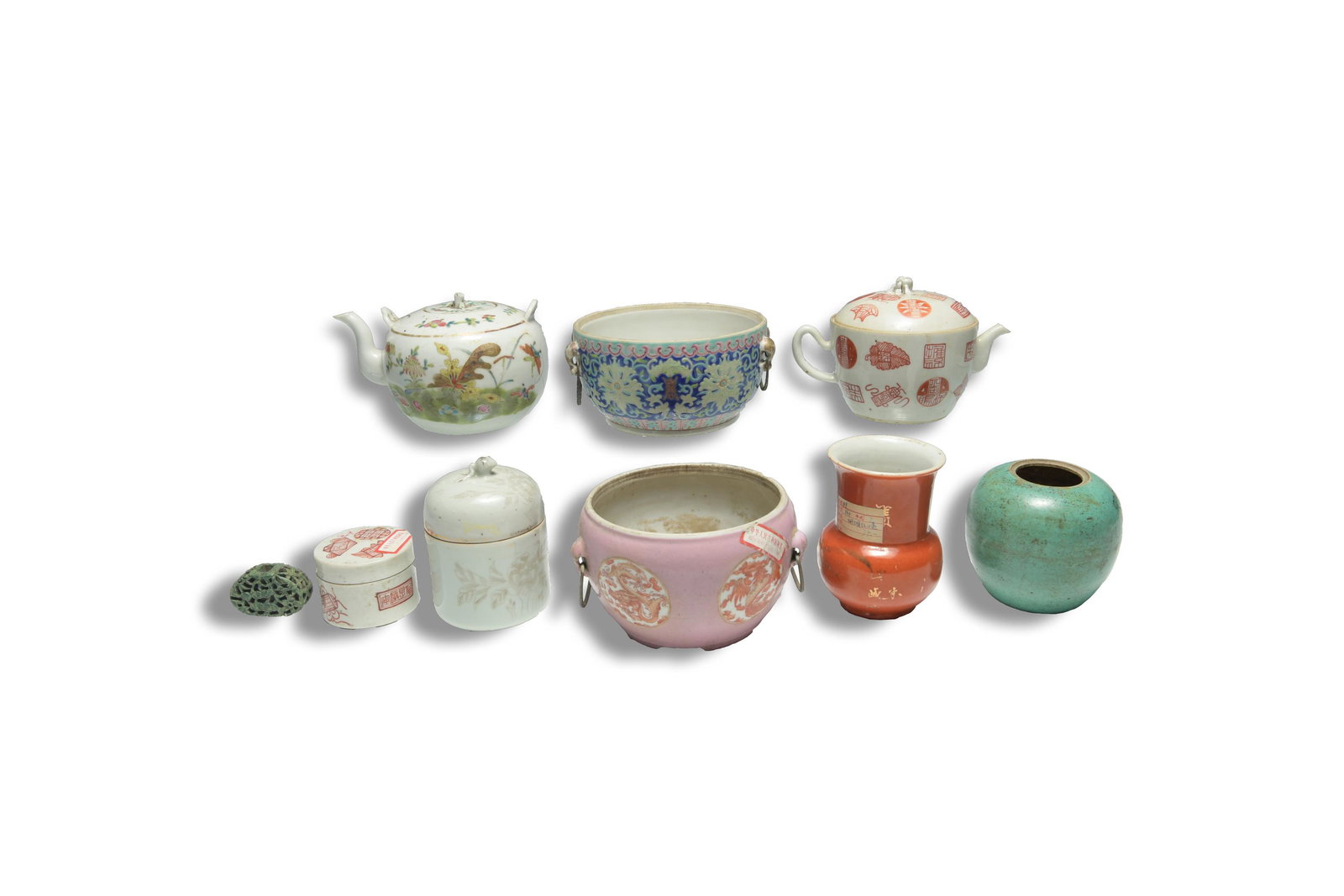 9 Chinese Famille Rose Porcelains, Qing: This lot includes two teapots, one wine warmer, one lidded box, two censors, one jar, one pommel, and one small vase. Signed lidded teapot with peach-handled lid, calligraphy, and geometric designed t
