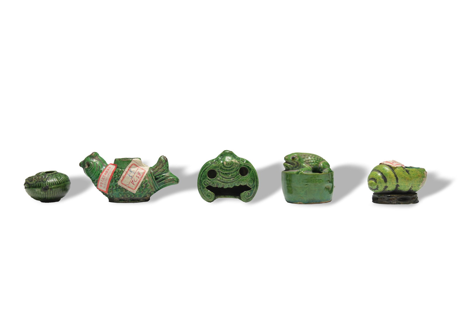 5 Chinese Green Glazed Water Coupes, 19th Century: Five Chinese water coupes with different shapes. Figures are a frog on a box, lizard on a jar, bat with flower on base bottom, seashell, and a mythical beast with a body of a fish and human head. Dime