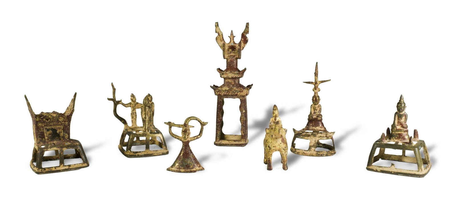 7 Antique Bronze Buddha: A set of seven antique, cast bronze figurines depicting Buddha and shrines. They are painted red. Provenance: Largest- 6 1/2 inches tall X 2 1/4 inches wide; 16.5 cm tall X 5.7 cm wide. All measuremen
